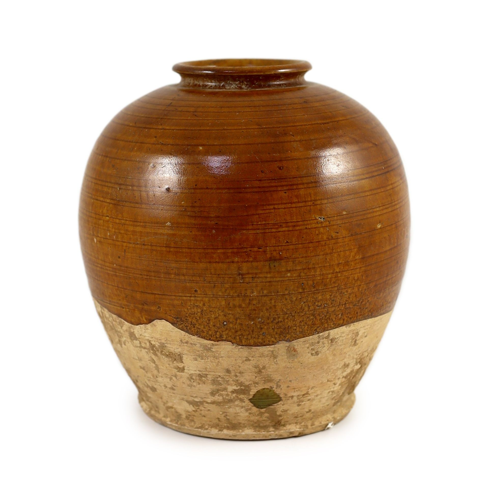 A Chinese straw glazed ovoid jar, Tang dynasty 19.5cm high                                                                                                                                                                  