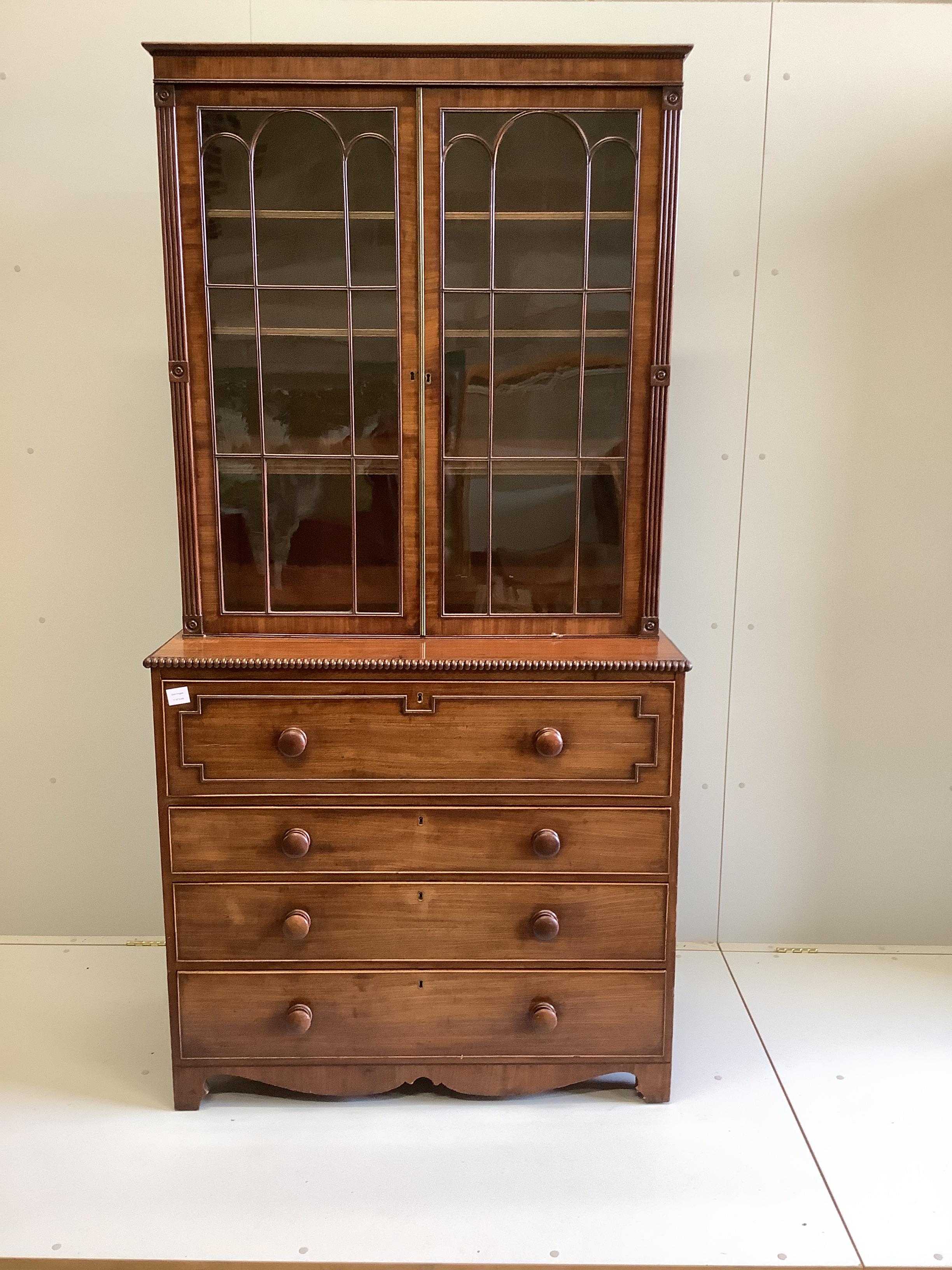 A Regency mahogany secretaire bookcase, the interior with turned ivory handles, width 106cm, depth 51cm, height 211cm (CITES Submission reference: 4R5H1VUJ)                                                                
