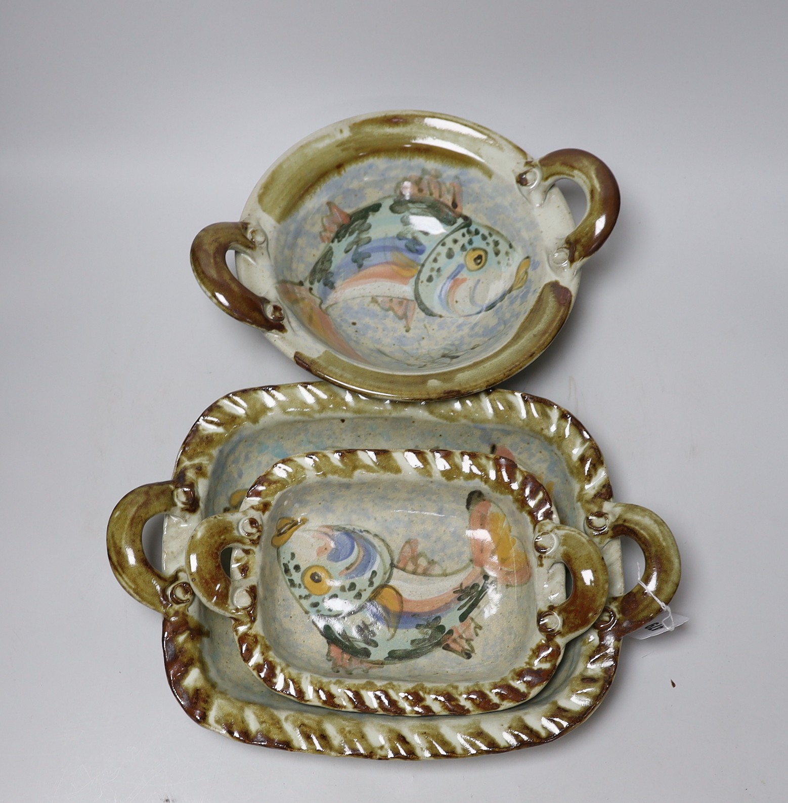 Three Roger Cockram pottery two handled dishes, largest 37cms                                                                                                                                                               