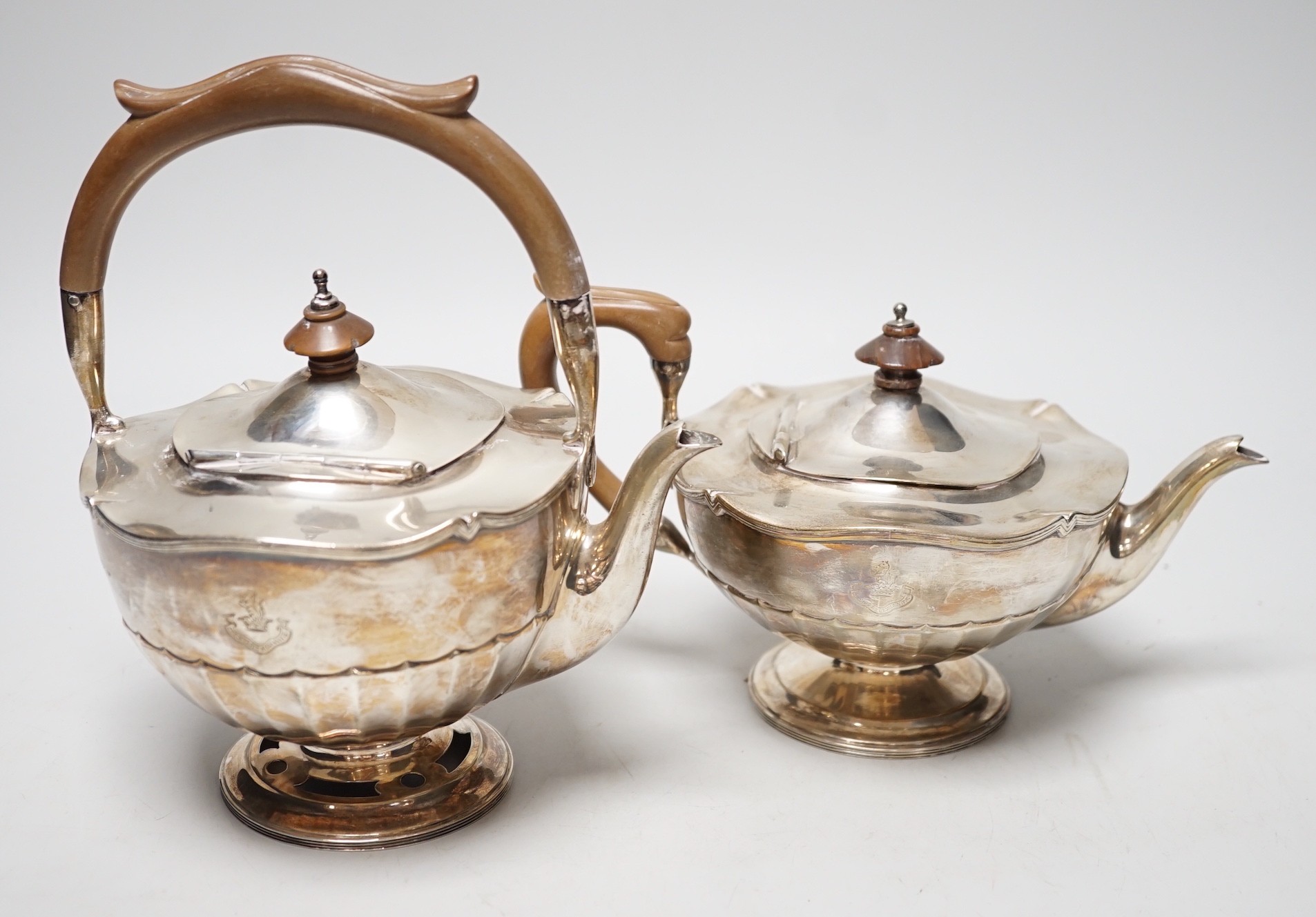 A George V silver tea kettle and teapot by Walker & Hall, Birmingham, 1919 & 1922, kettle height 20.5cm, 30.6oz.                                                                                                            