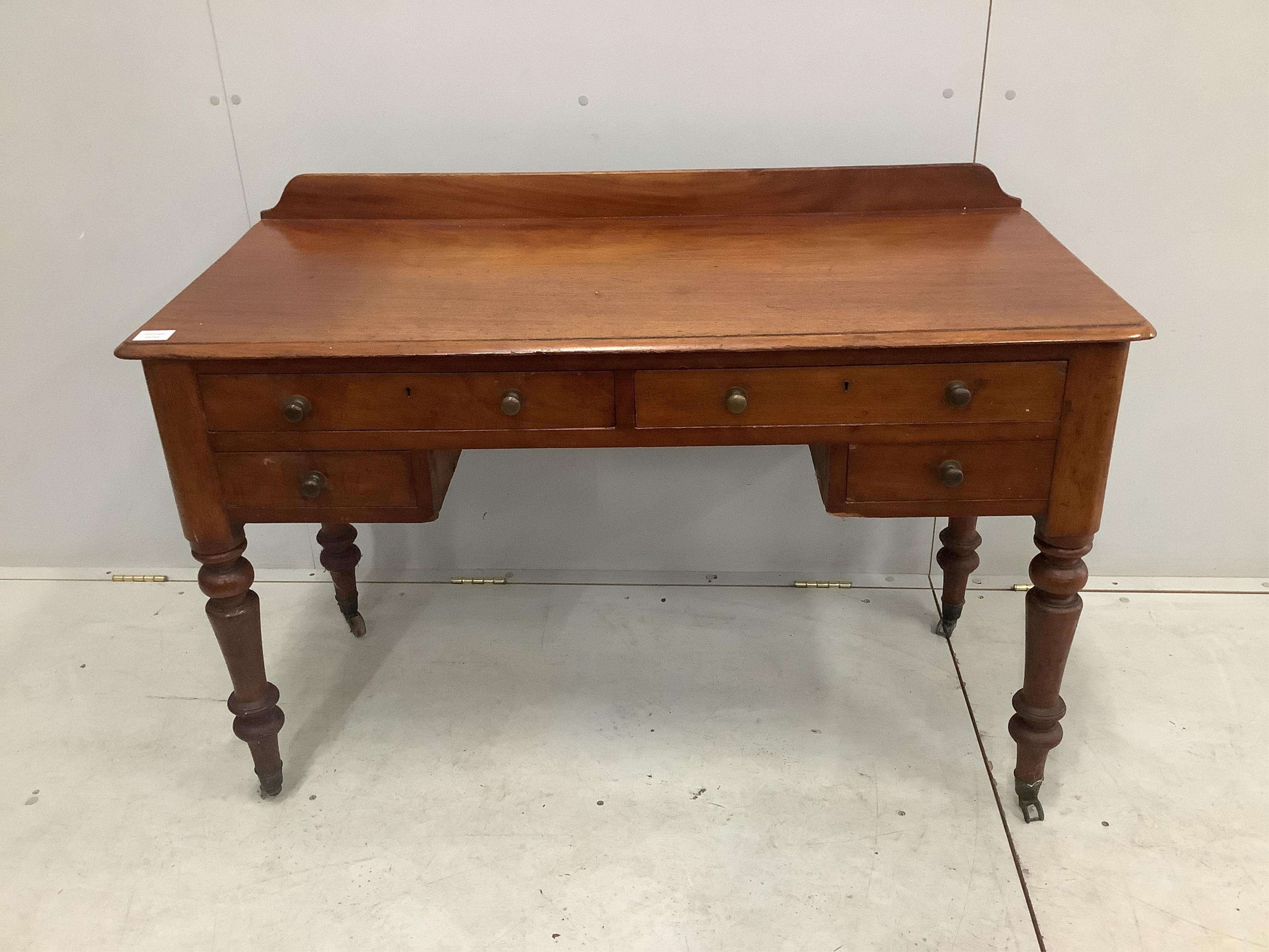 A Victorian mahogany four drawer side table, width 121cm, height 82cm. Condition - fair                                                                                                                                     