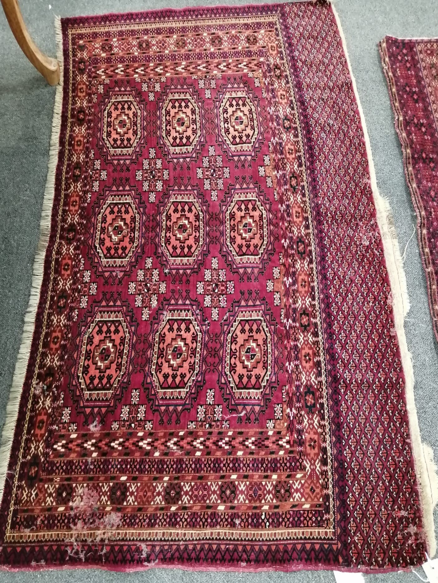 A Tekke burgundy ground rug, 148 x 86cm                                                                                                                                                                                     