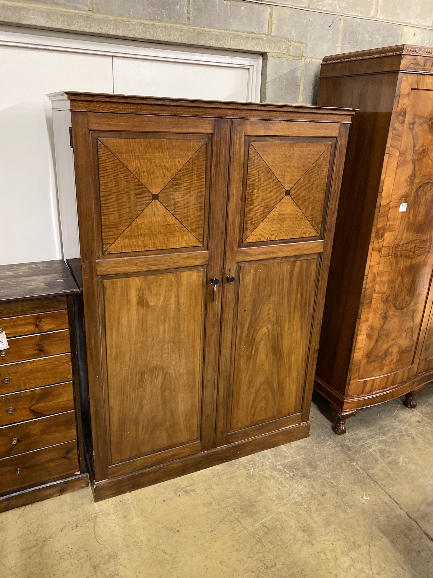 An early 20th century Heal & Son mahogany compactum wardrobe, width 127cm, depth 56cm, height 179cm                                                                                                                         