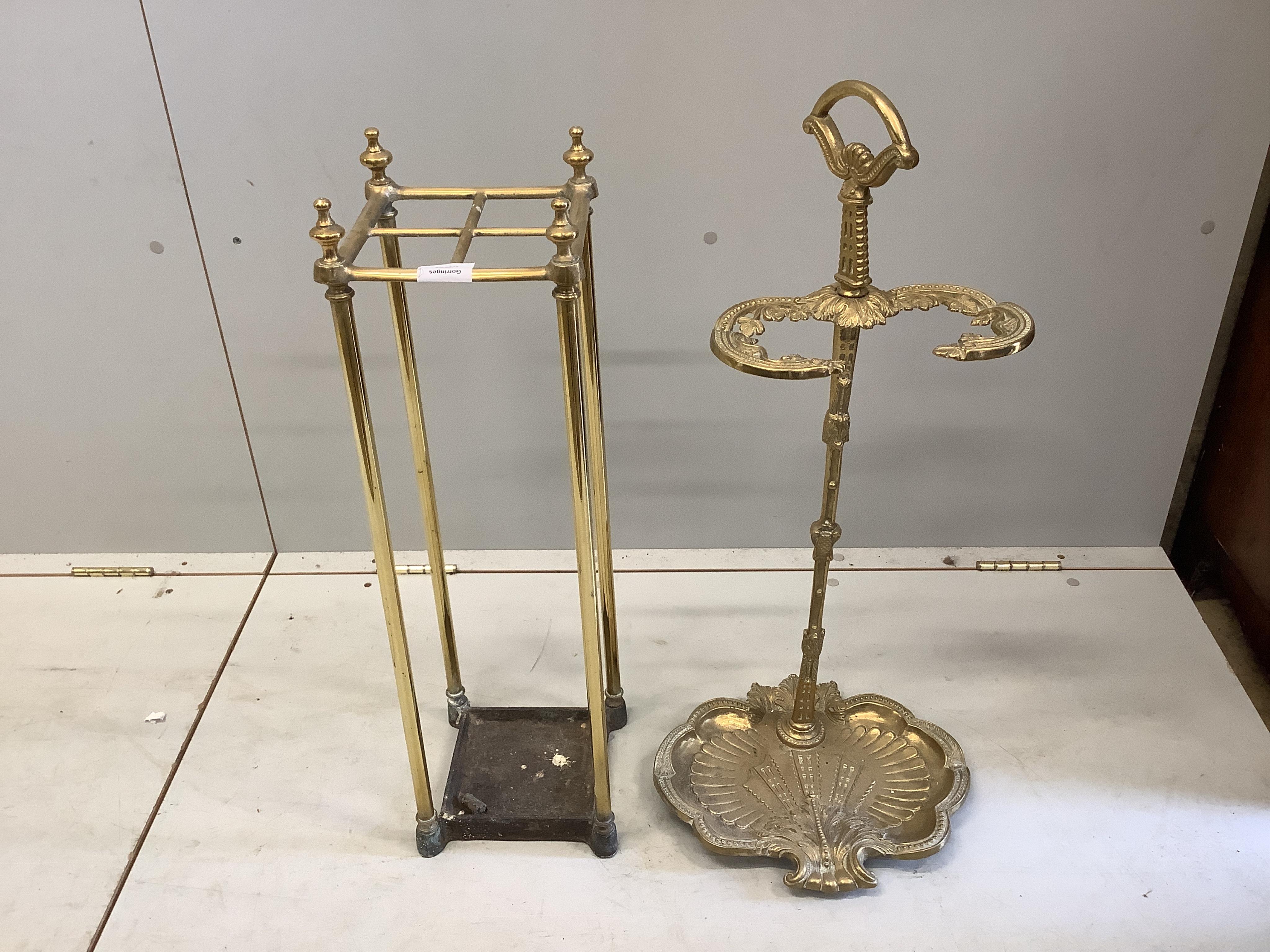 An early 20th century brass and cast iron four division stick stand, height 68cm, together with a reproduction brass stick stand. Condition - good                                                                          