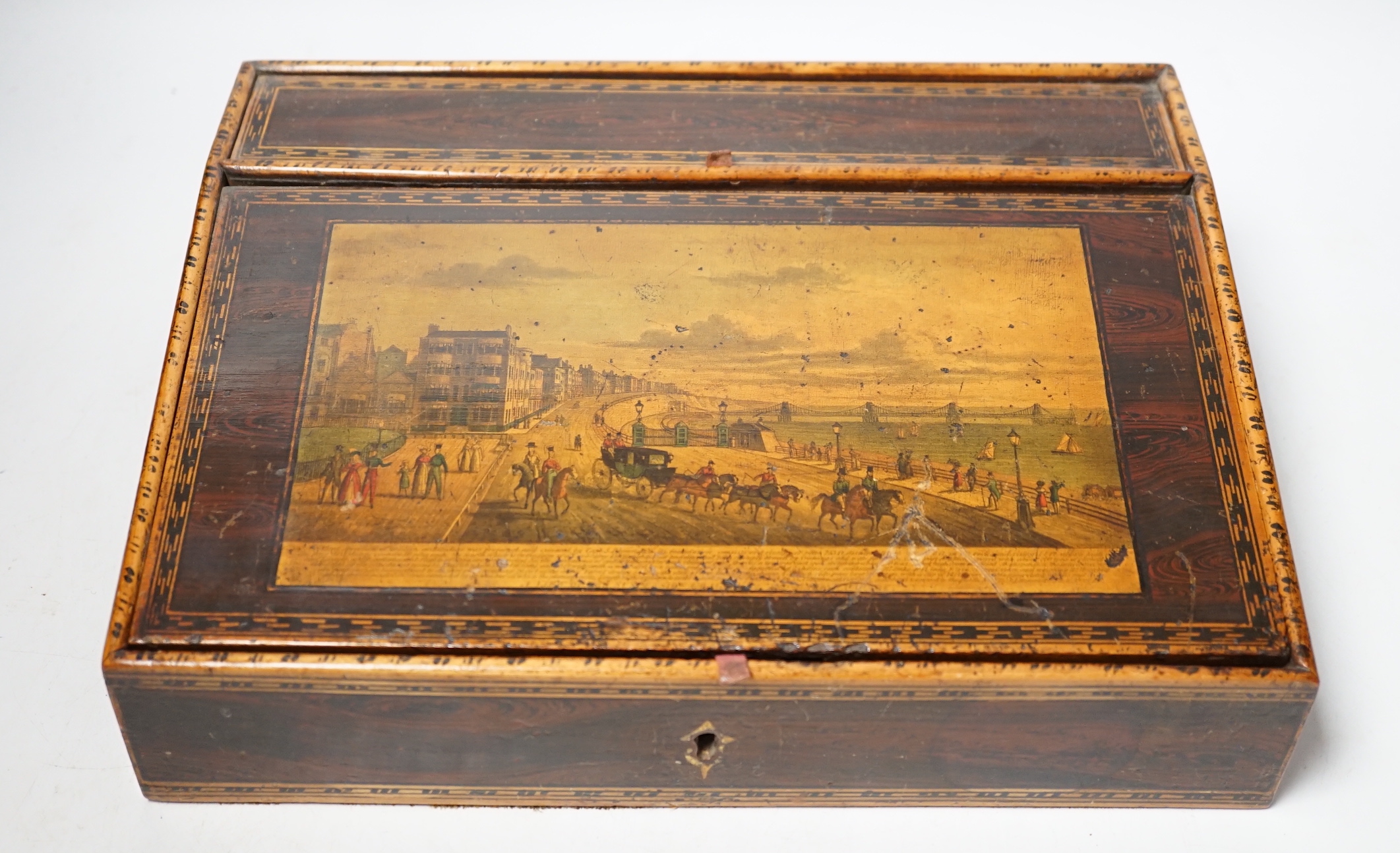 A Regency faux rosewood writing box printed with a view of Brighton, 29cm wide                                                                                                                                              