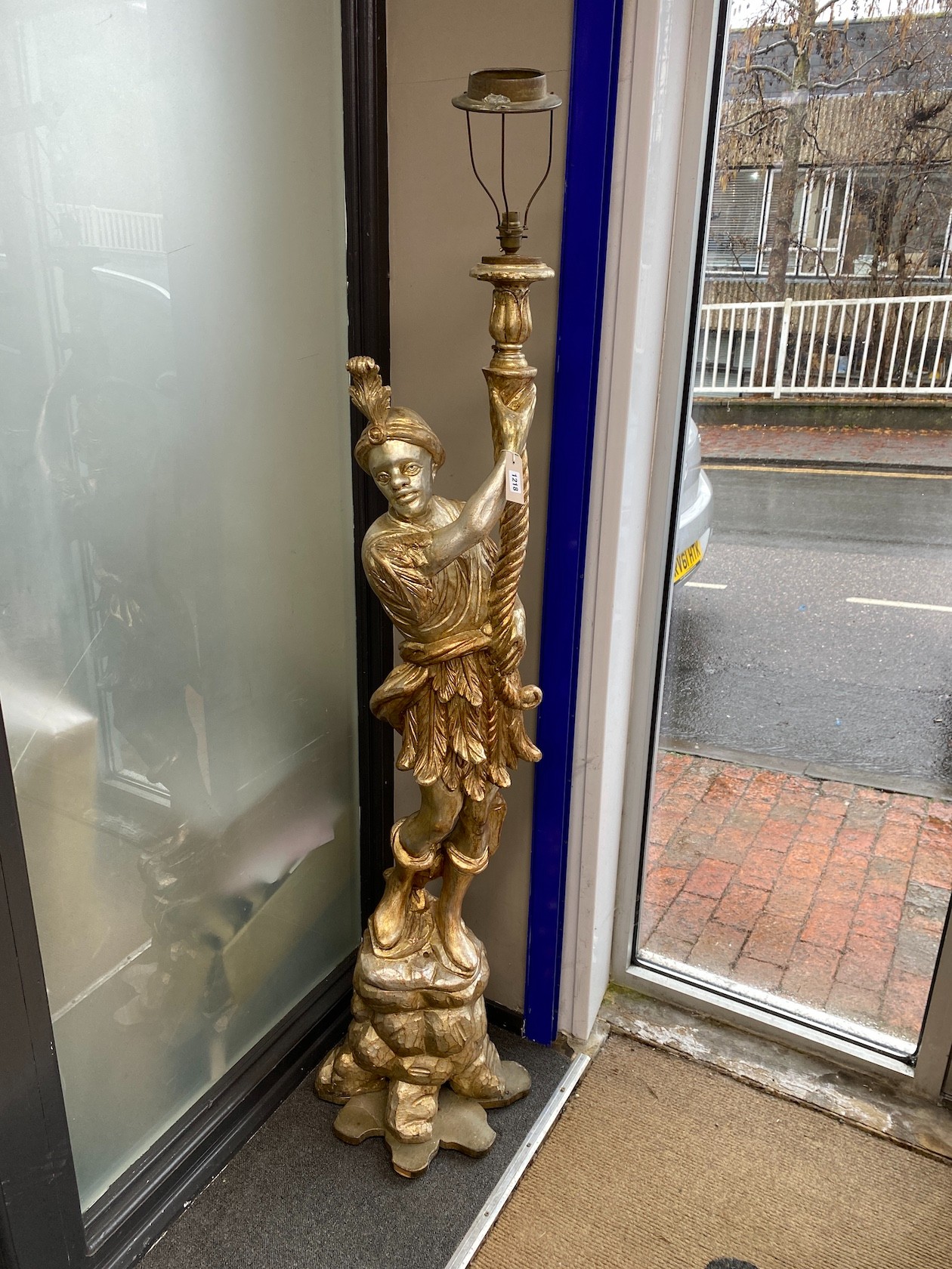 A pair of Italian style silvered and parcel gilt Blackamoor floor lamps, height 159cm                                                                                                                                       