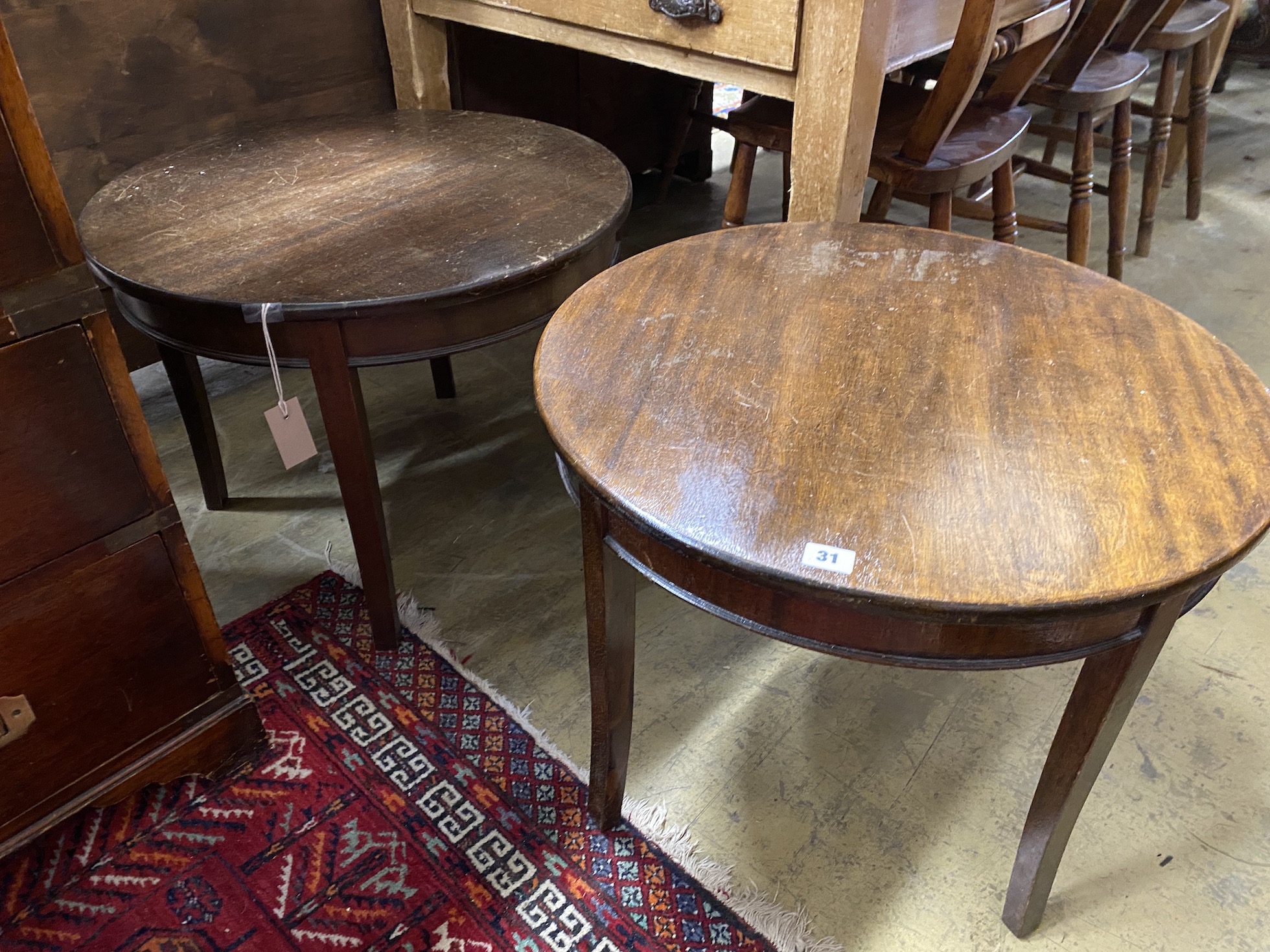 A pair of circular mahogany and beech occasional tables, diameter 61cm, height 46cm                                                                                                                                         