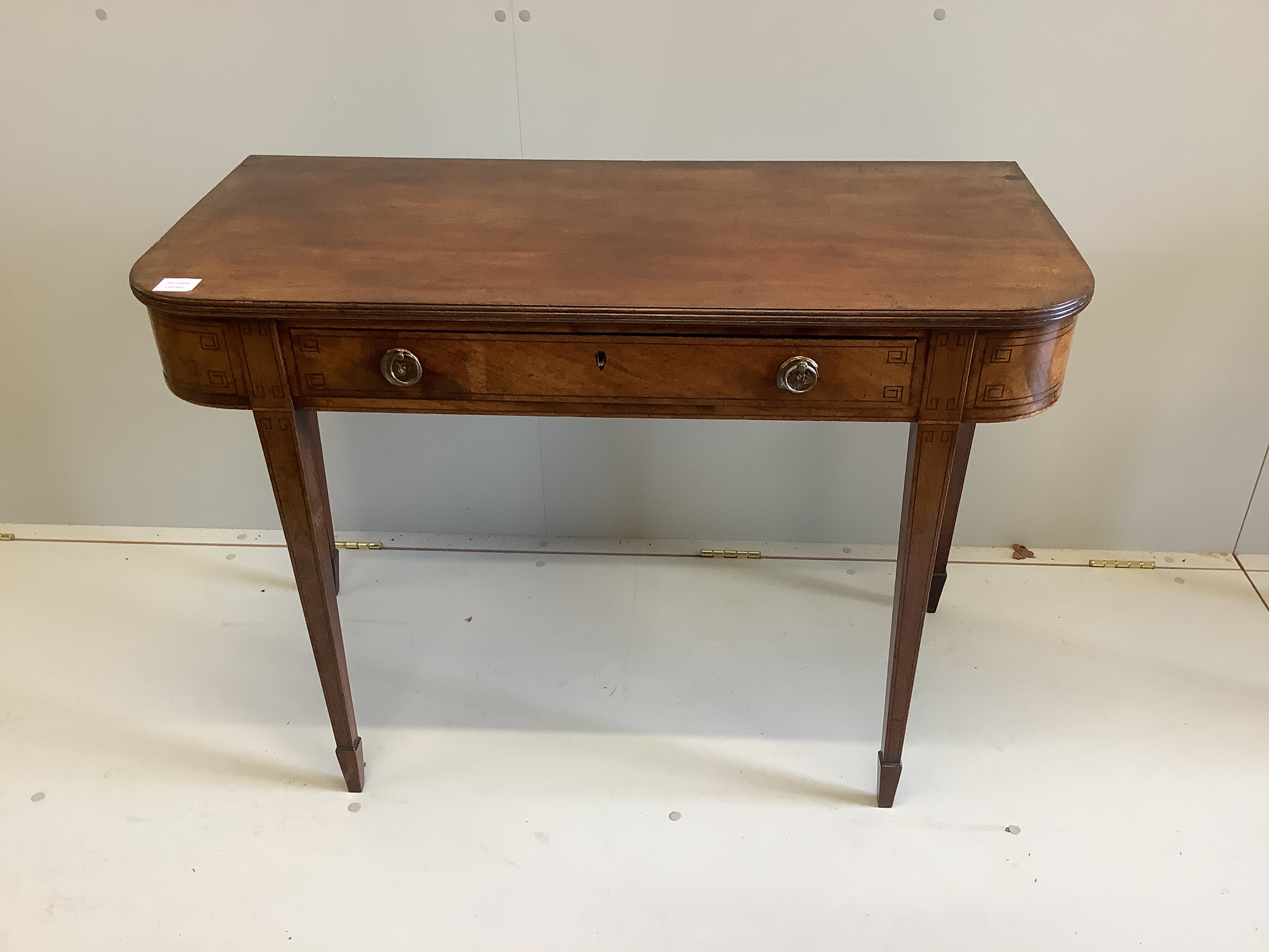 An early 19th century mahogany D shaped side table, with strung borders, width 103cm, depth 47cm, height 73cm                                                                                                               