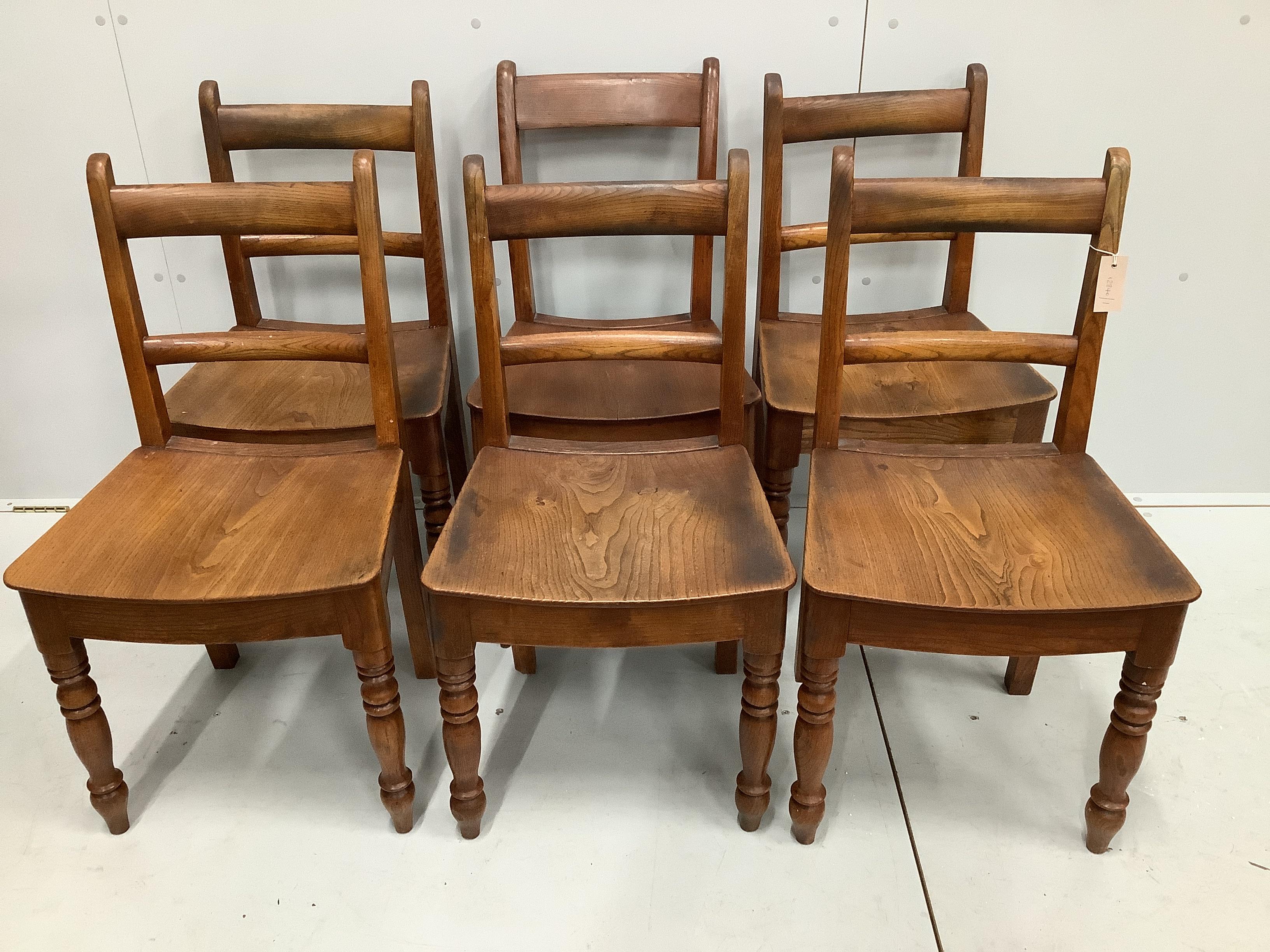 A harlequin set of six Regency Provincial elm and beech wood seat dining chairs                                                                                                                                             
