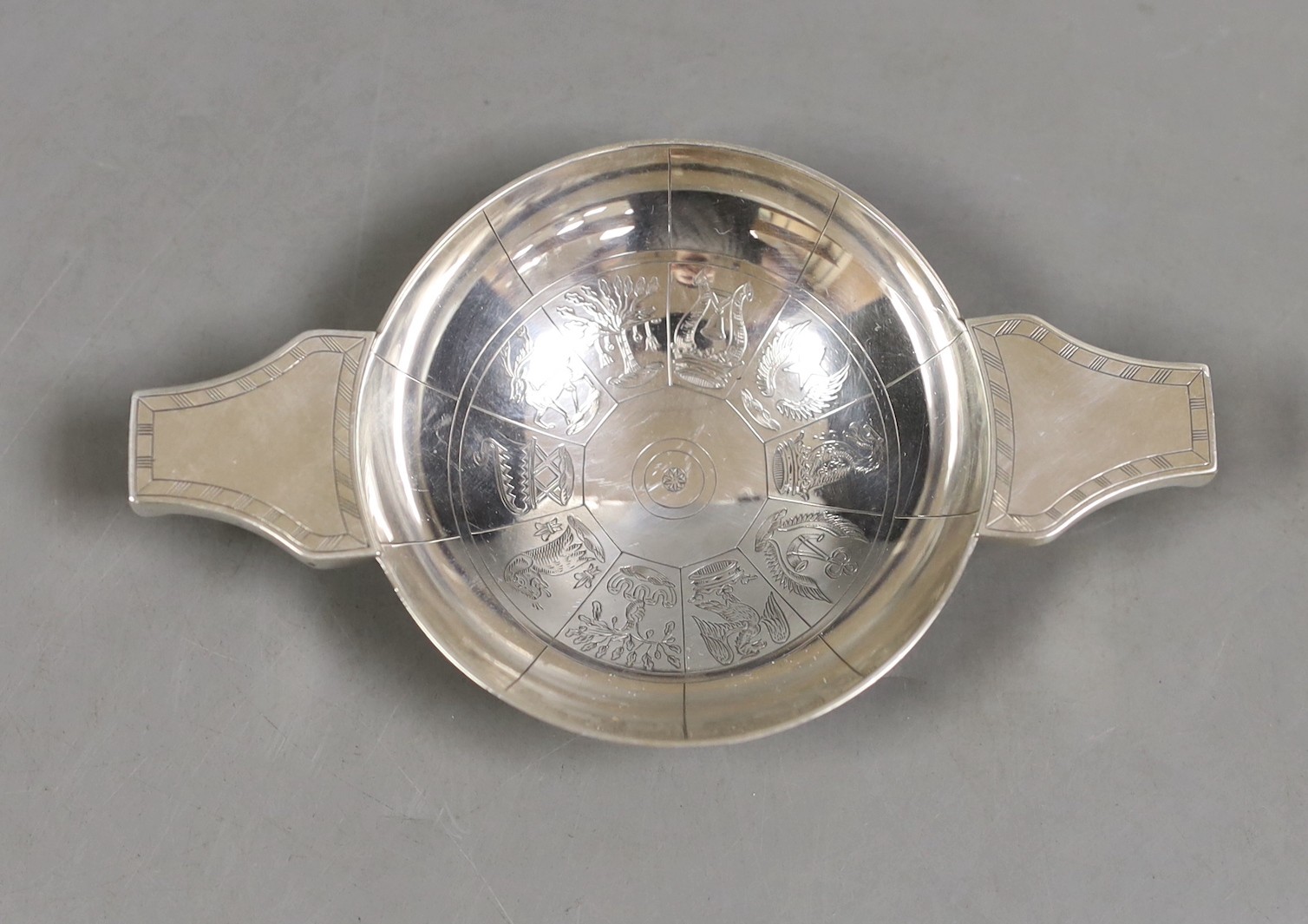 A mid 20th century Scottish silver quaich, engraved with the signs of the zodiac, George Evelyn Paget How, Edinburgh, 1952, 12.8cm, 76 grams.                                                                               