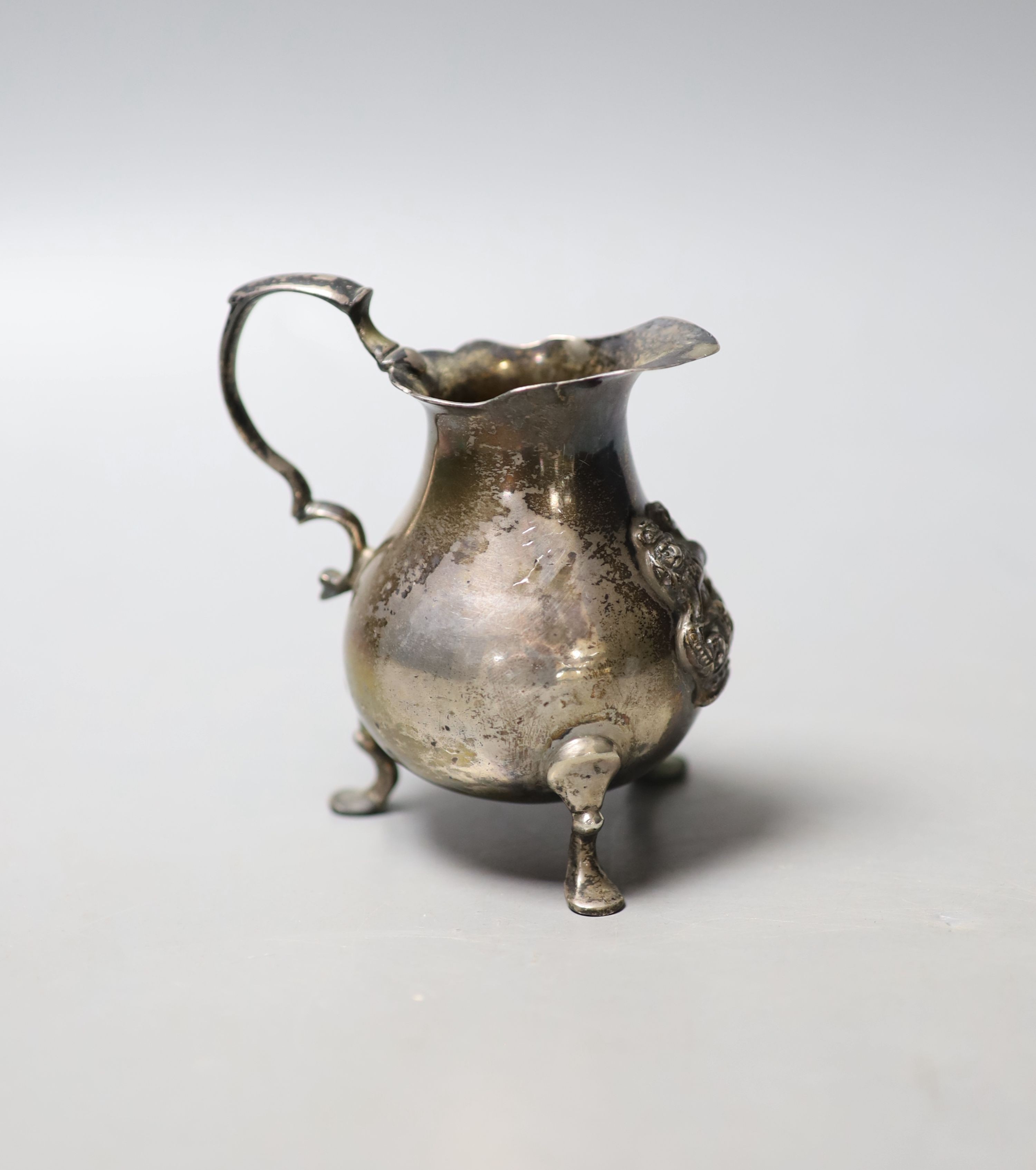 A George II silver baluster cream jug, John Pollack, London, 1742, 89mm, 114 grams.                                                                                                                                         
