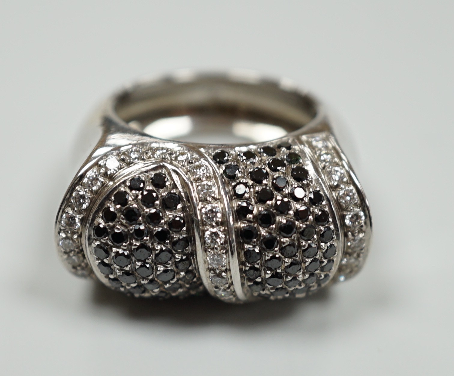 A modern 750 white metal and pave set two colour diamond dress ring, size K/L, gross weight 15.4 grams.                                                                                                                     