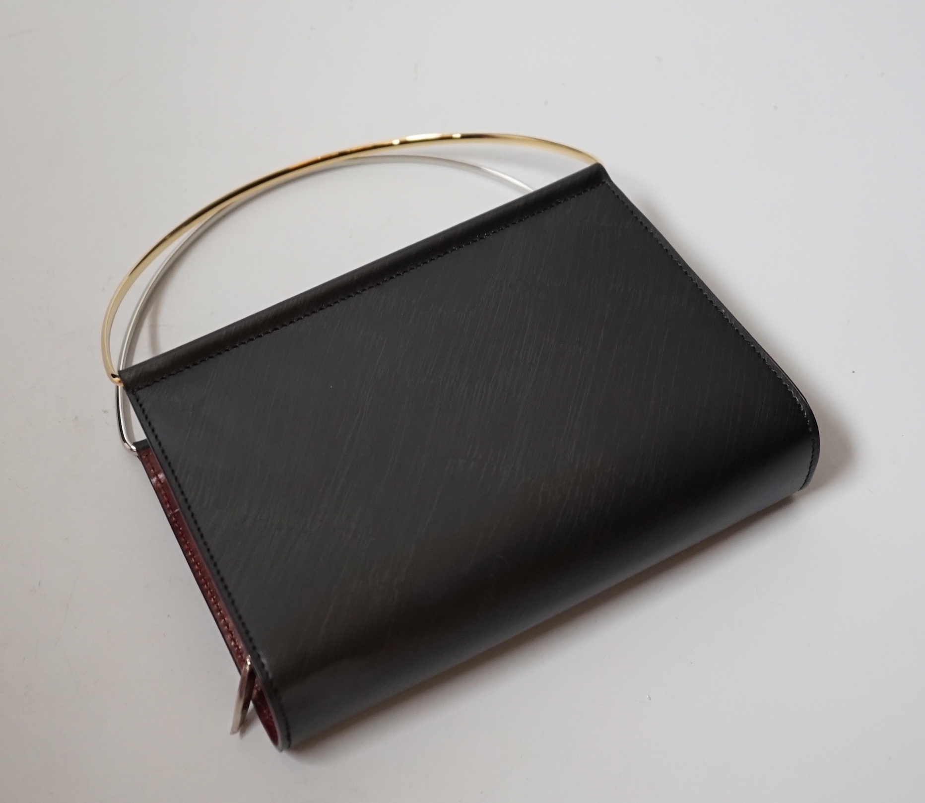 A small Cartier lady’s leather evening bag, 16cm wide, with original box                                                                                                                                                    