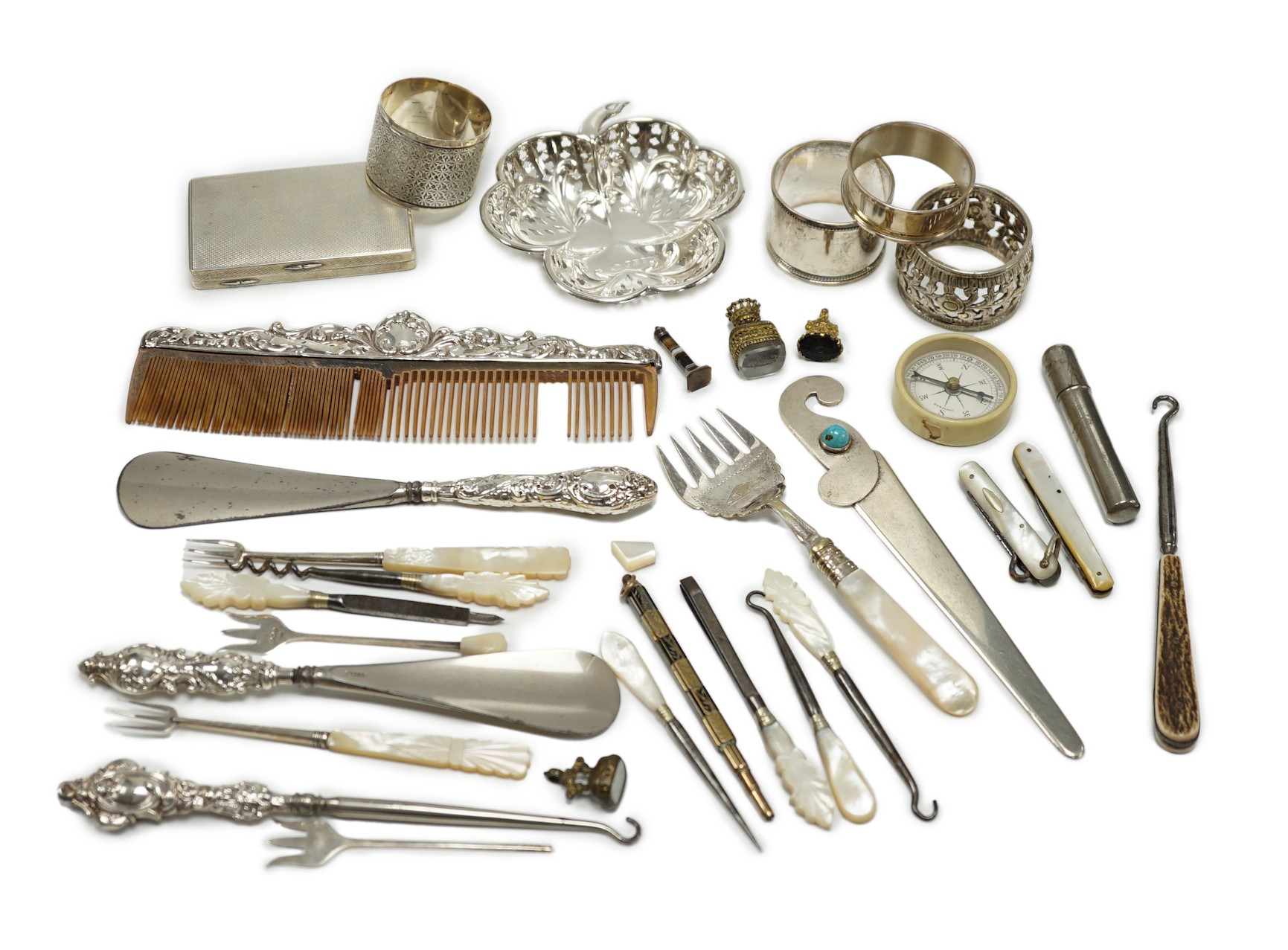 A group of assorted small silver and white metal items, including a small late Victorian clover shaped nut dish, napkin rings, pill box, etc and other items including two gilt metal mounted chalcedony fob seals.         