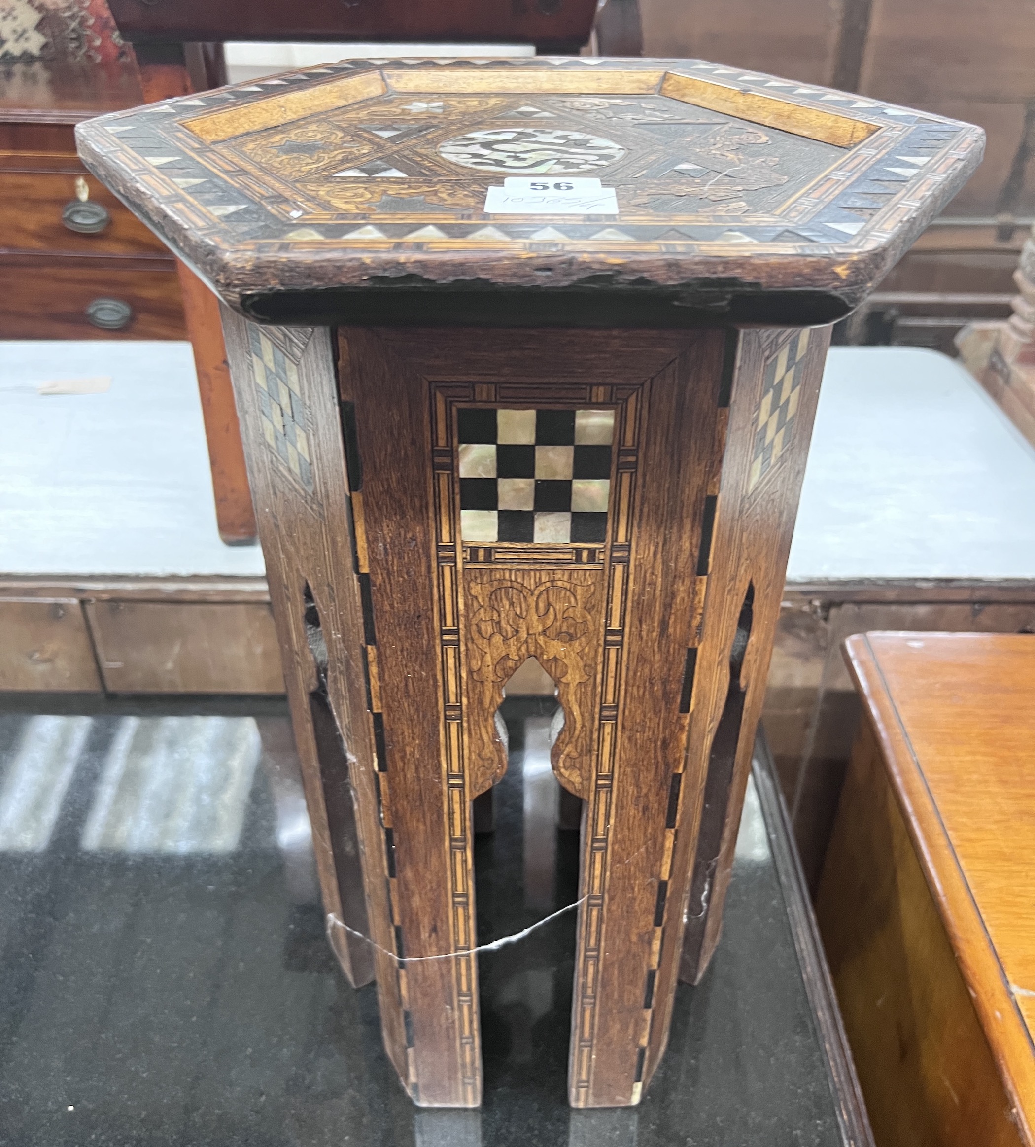 A Moorish mother of pearl inlaid hexagonal occasional table, width 32cm, height 46cm                                                                                                                                        