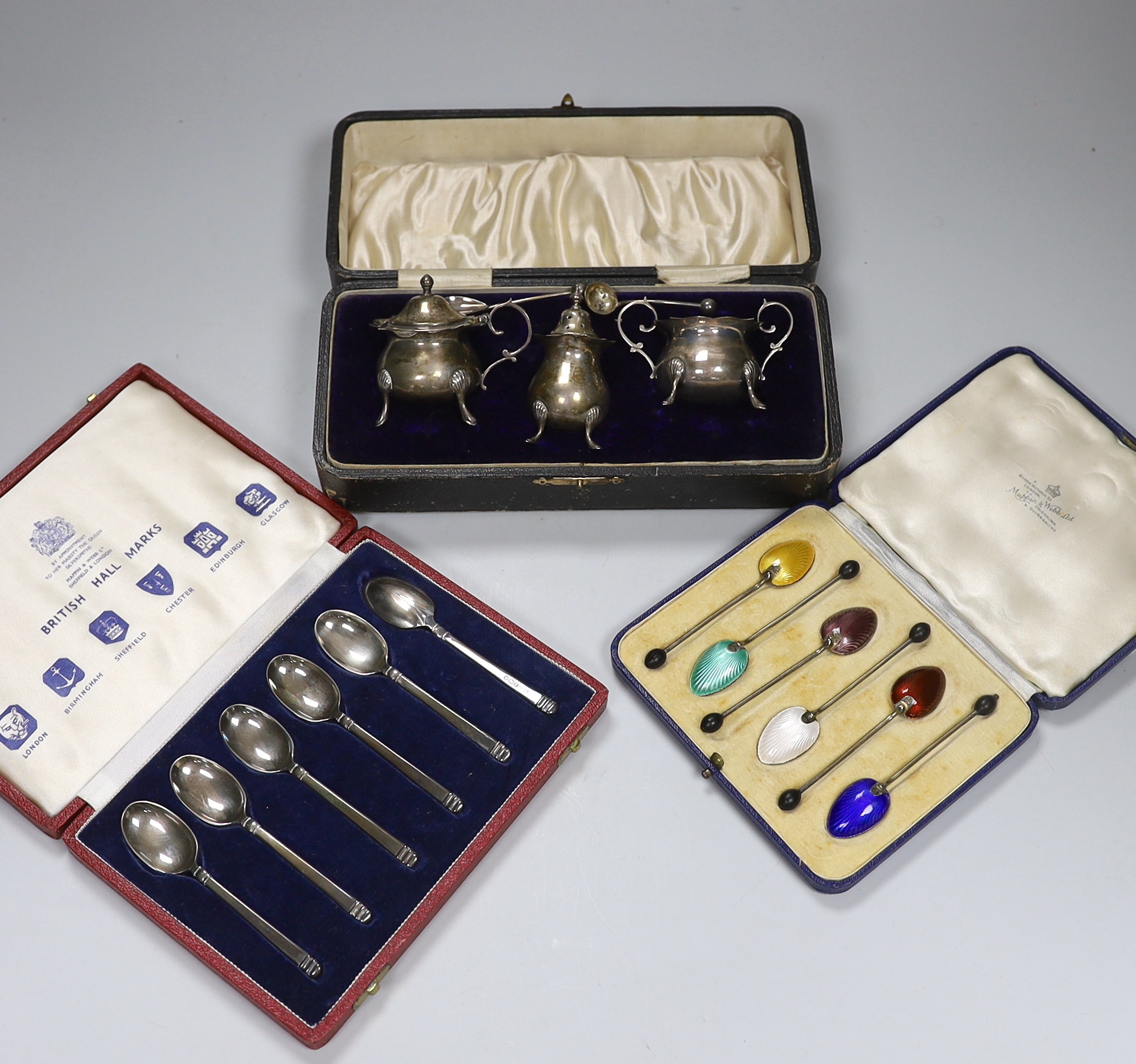 A cased set of six George V silver coffee bean coffee spoons, with enamelled bowls, Birmingham 1933, gross 50 grams, a set of six coffee spoons, with British Assay Office hallmarks, Birmingham, 1971, 74 grams and an Edwa