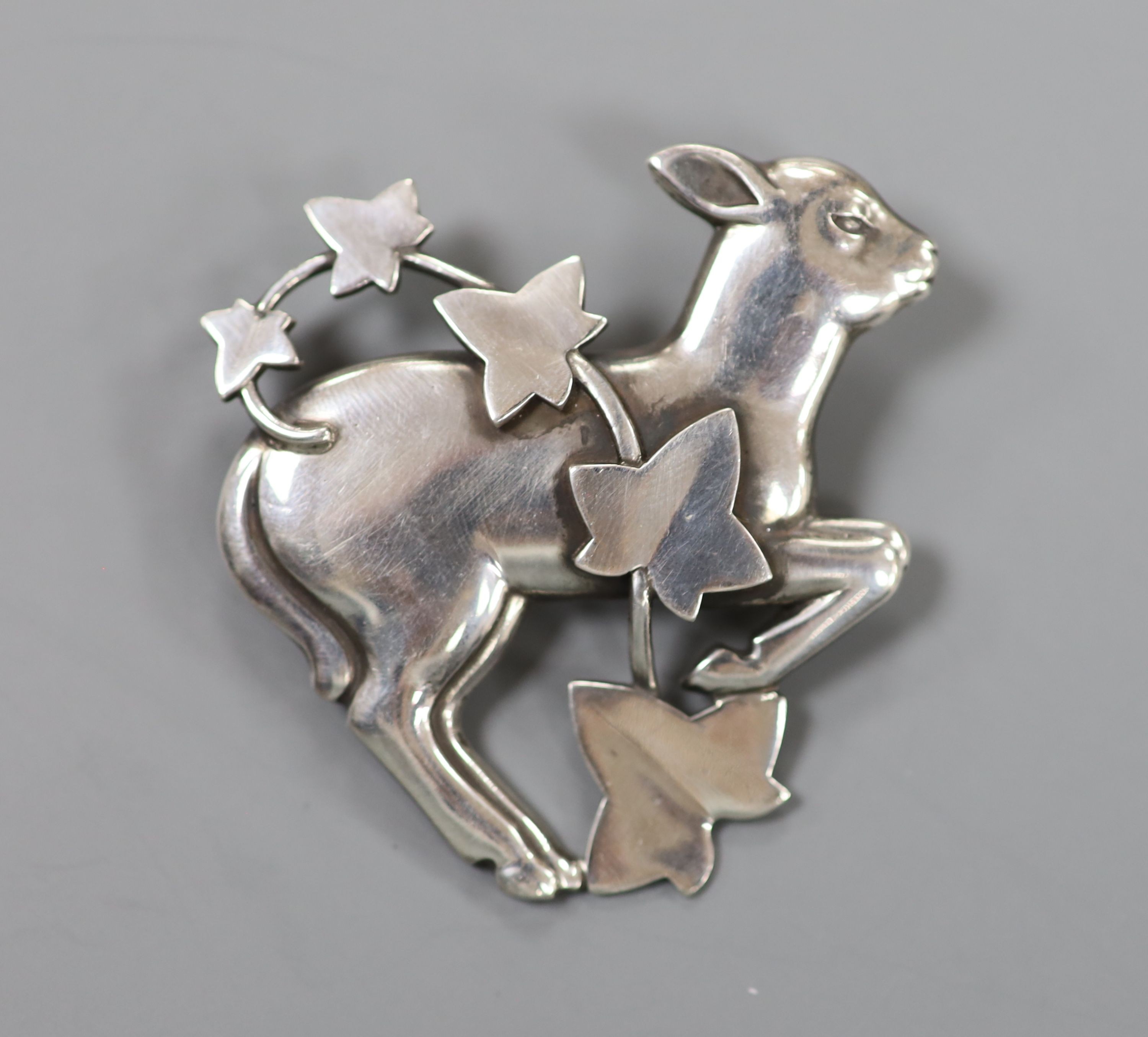 A Georg Jensen sterling lamb and frond brooch, no. 311, 47mm.                                                                                                                                                               