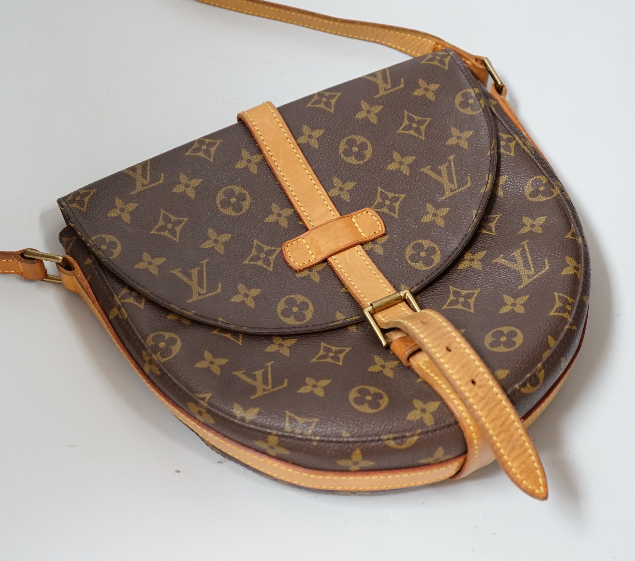 A Louis Vuitton lady’s handbag, horseshoe shaped, 28cm wide                                                                                                                                                                 