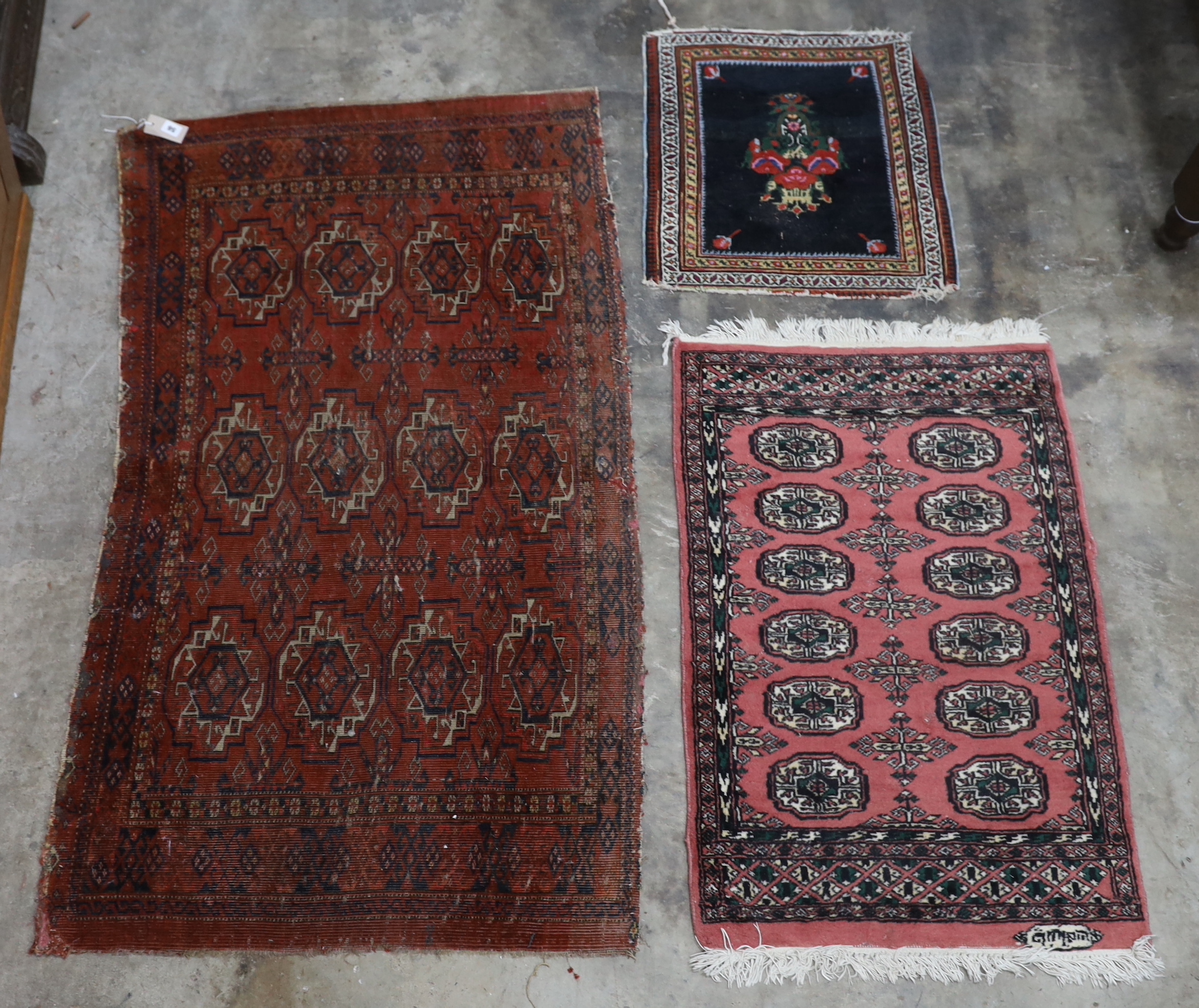 An antique Tekke red ground rug, a Caucasian rug and three others, largest 194 x 138cm                                                                                                                                      