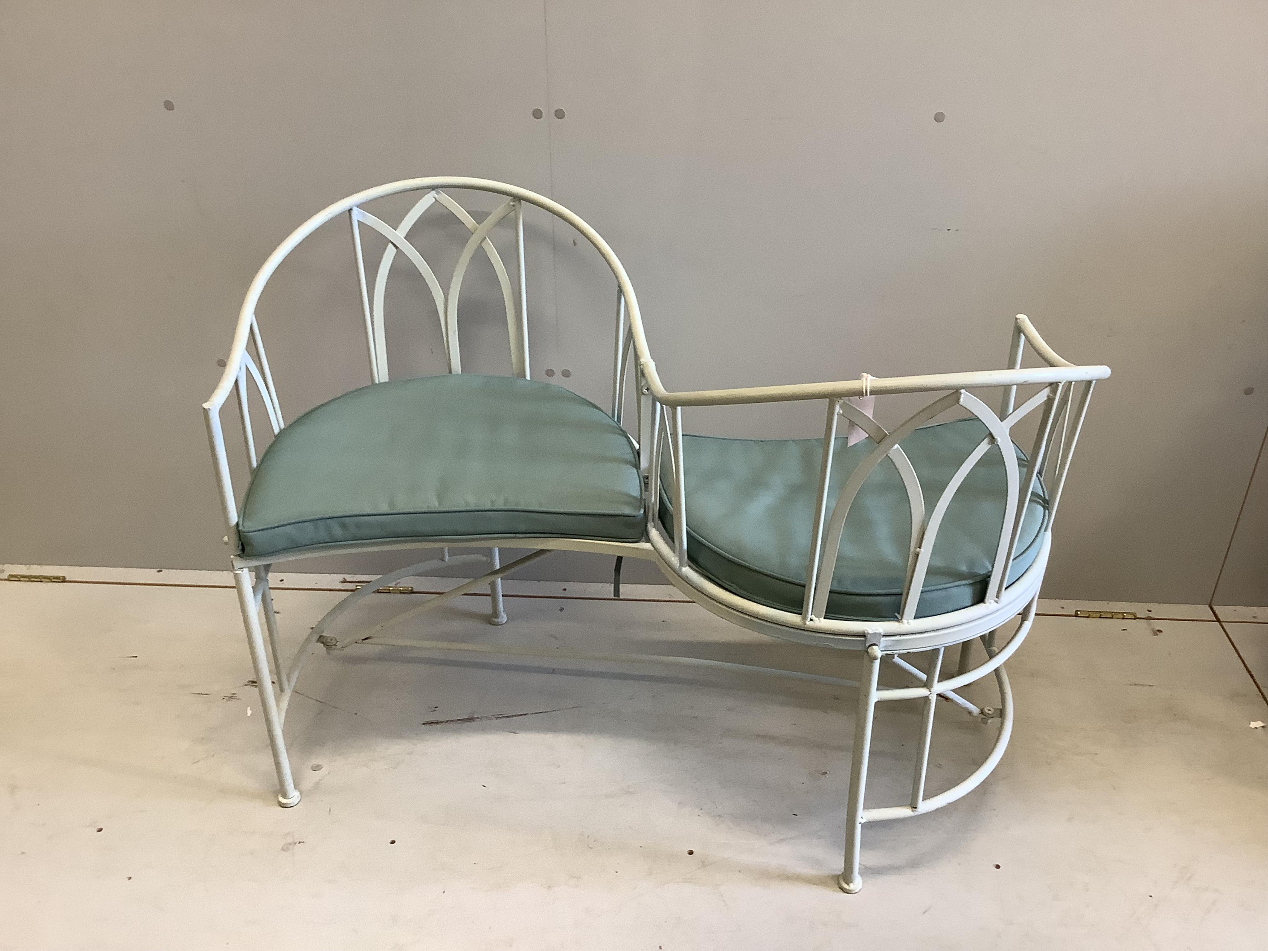 A modern painted metal garden love seat, width 110cm, depth 74cm, height 81cm. Condition - good                                                                                                                             