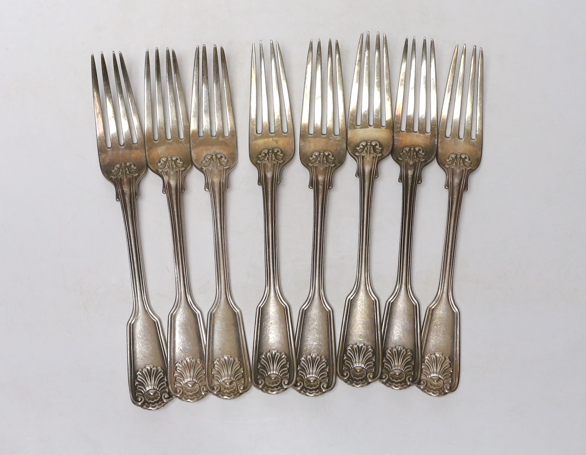 A set of eight Victorian silver fiddle, thread and shell pattern table forks, by George Adams, London, 1859, 20.3cm, 25.8oz.                                                                                                