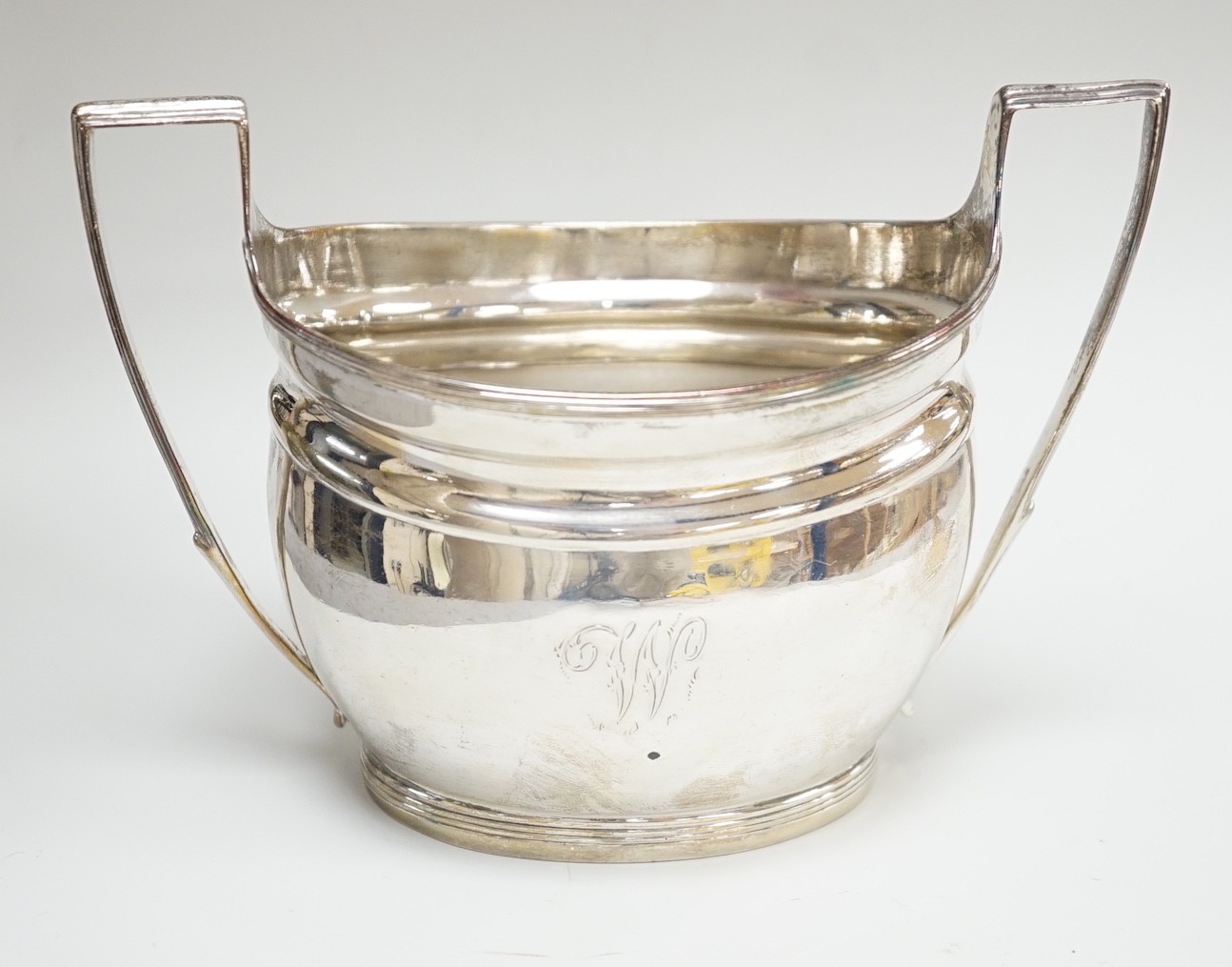 A George III silver two handled sugar bowl, by Thomas Wallis II, London, 1800, 15cm over handles, 6.4oz.                                                                                                                    