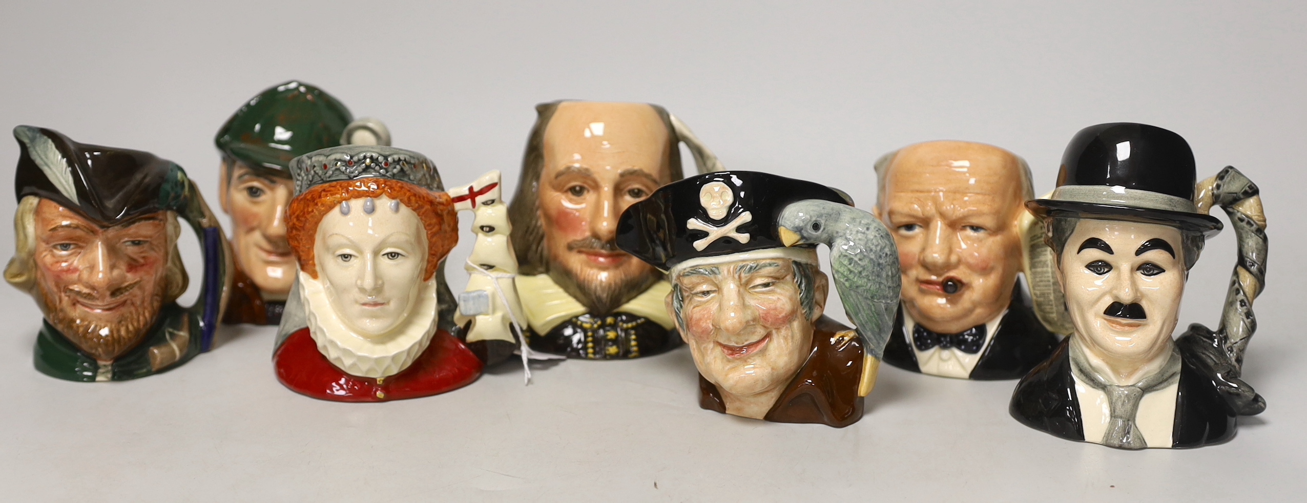 Royal Doulton character jugs including Queen Elizabeth I, D6821, Charlie Chaplin, D7145, Winston Churchill, D6934, William Shakespeare, D6938, Long John Silver, D6404, Robin Hood, D6534 and Sleuth, D6655                 