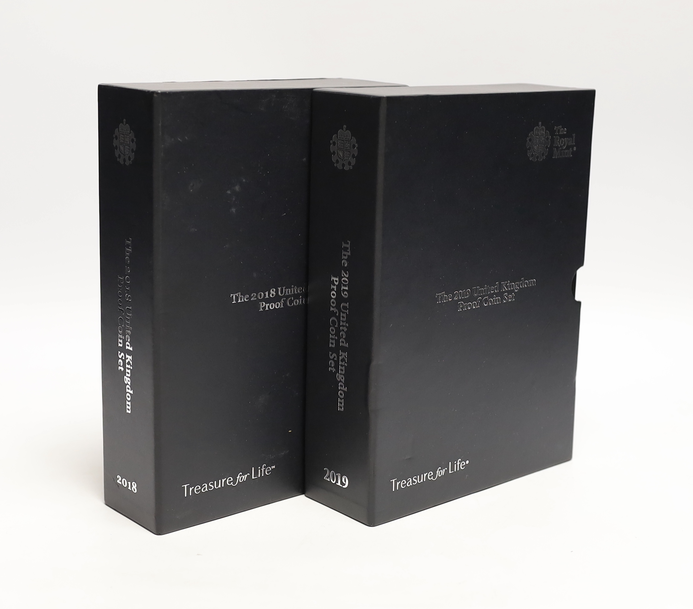 Two Royal Mint UK QEII Proof coin sets for 2018 and 2019, each containing definitive and commemorative coins, 2 cases                                                                                                       