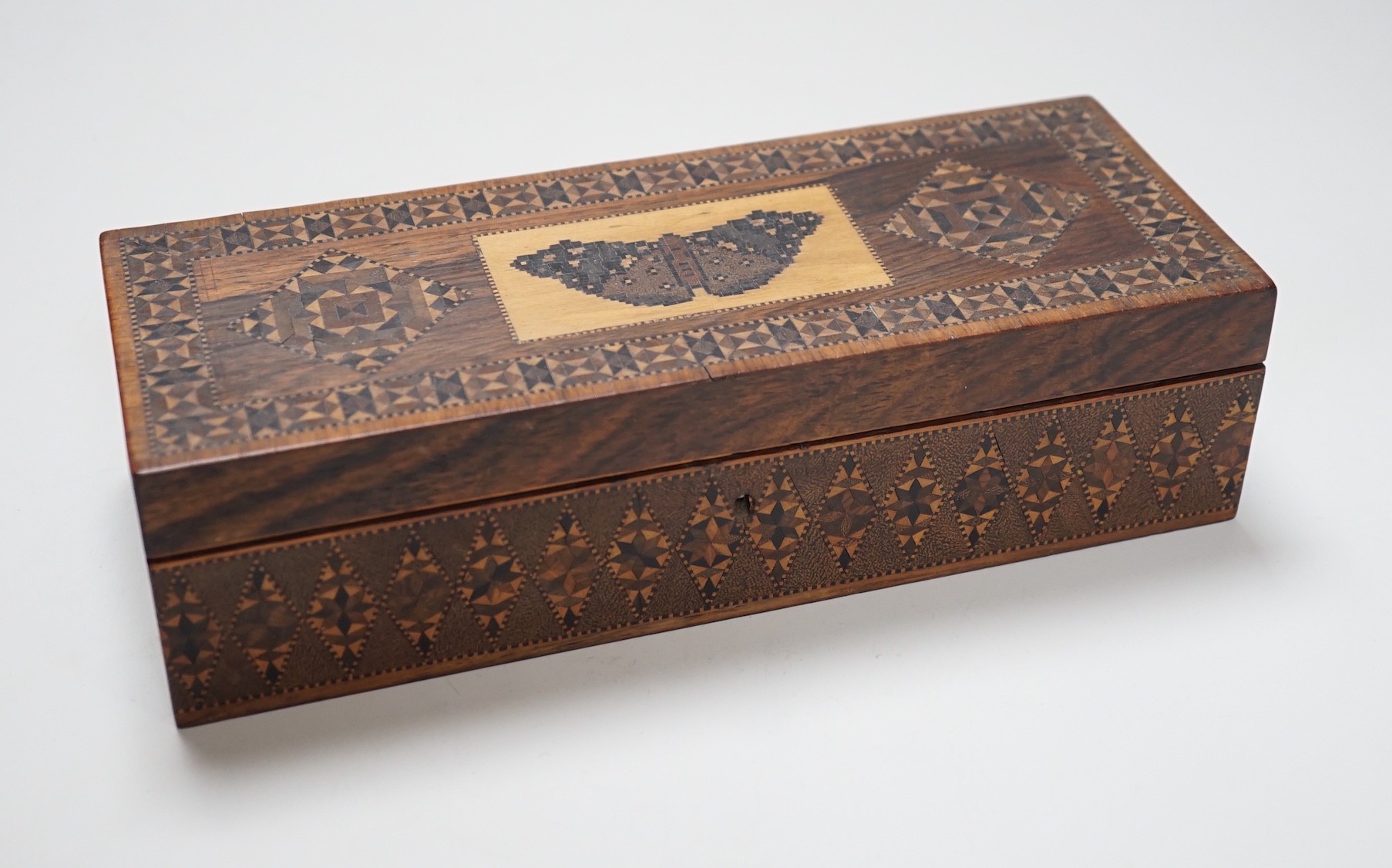 A Tunbridge ware rosewood half square mosaic and butterfly mosaic glove box, c.1830-50, 24cms wide x 6.5 high                                                                                                               