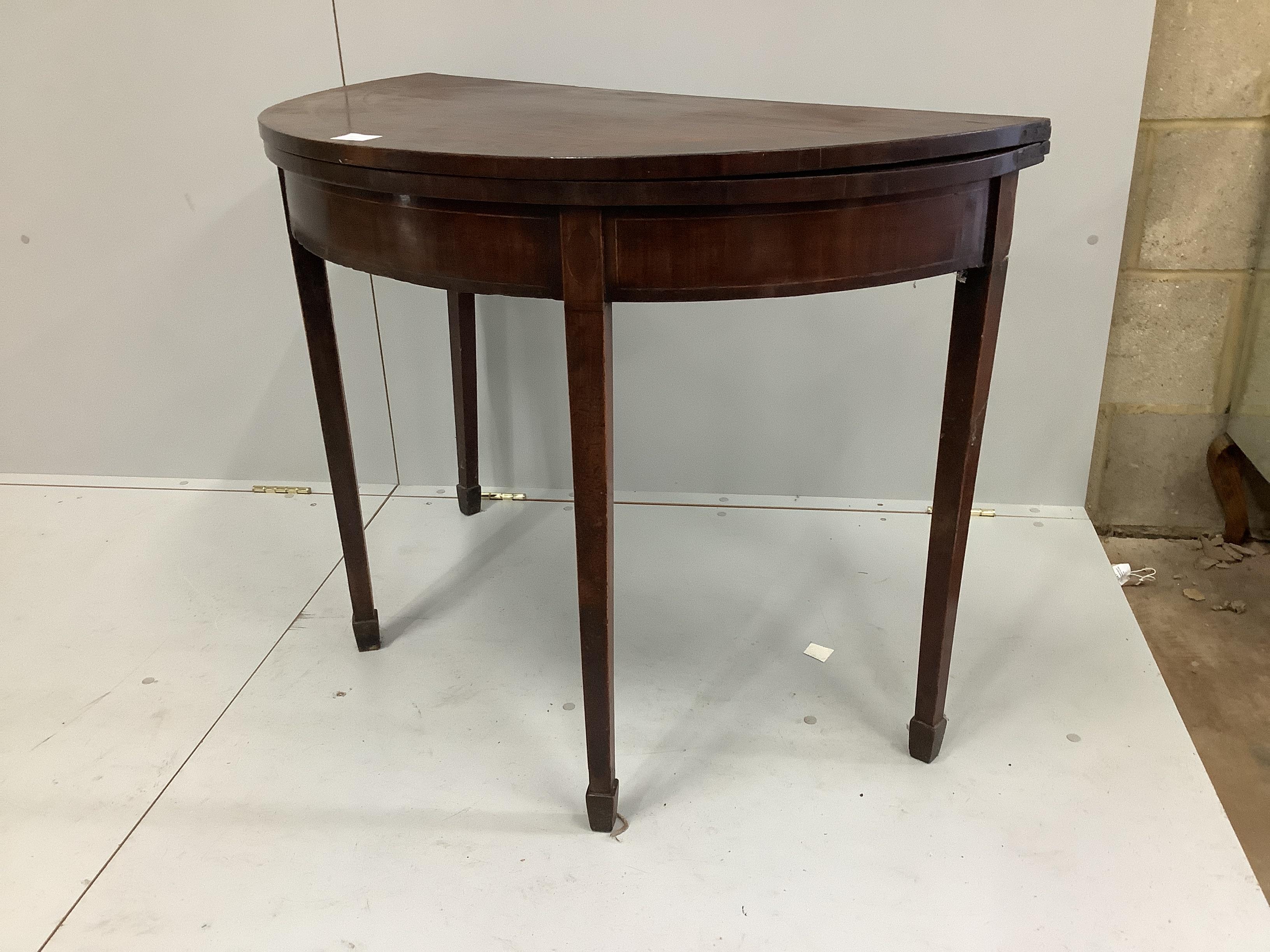 A George III banded mahogany D shaped tea table, width 99cm, depth 49cm, height 73cm                                                                                                                                        