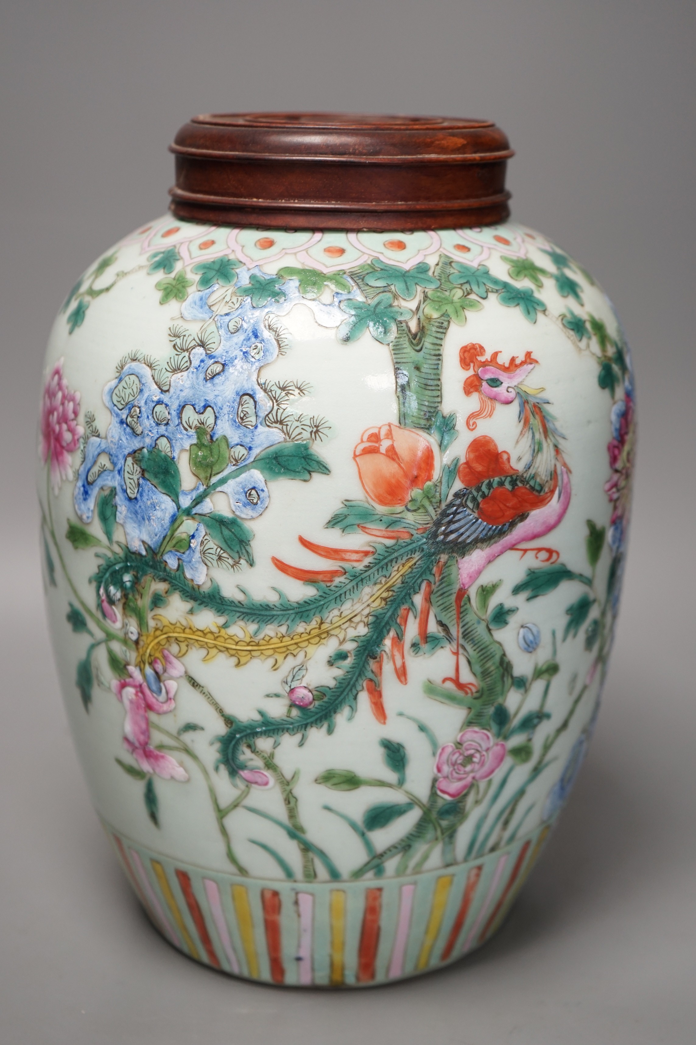 A 19th century Chinese famille rose 'phoenix' jar with wood cover, 30cm tall                                                                                                                                                