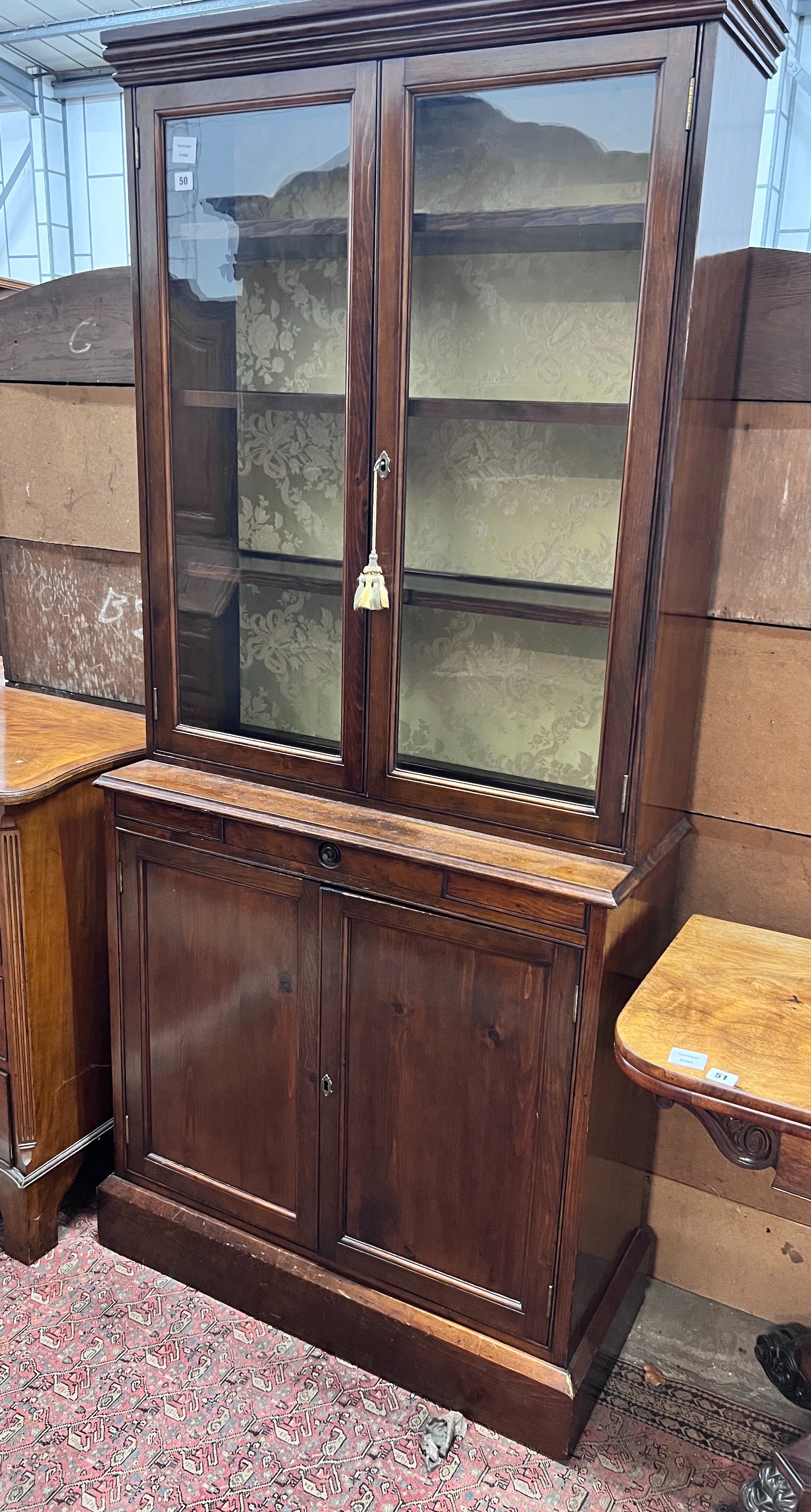 A Victorian pine bookcase cupboard, width 86cm, depth 35cm, height 190cm *Please note the sale commences at 9am.                                                                                                            