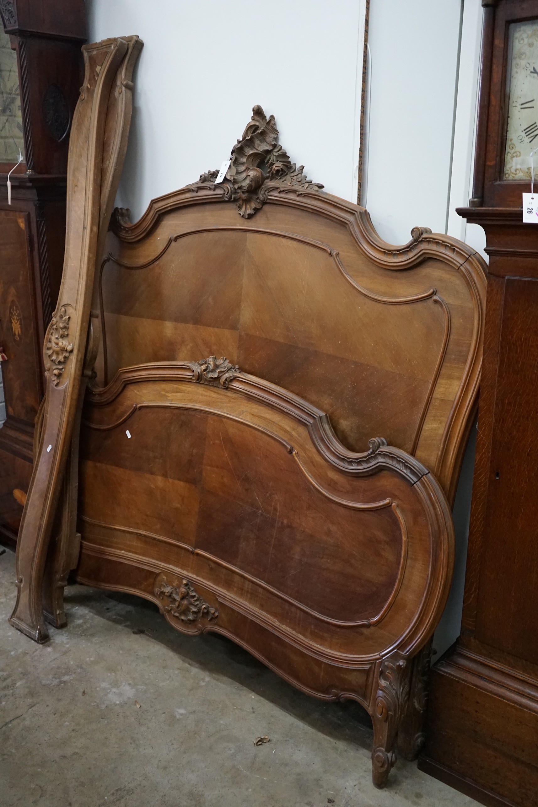 An early 20th century French walnut double bed frame, width 152cm, height 165cm                                                                                                                                             