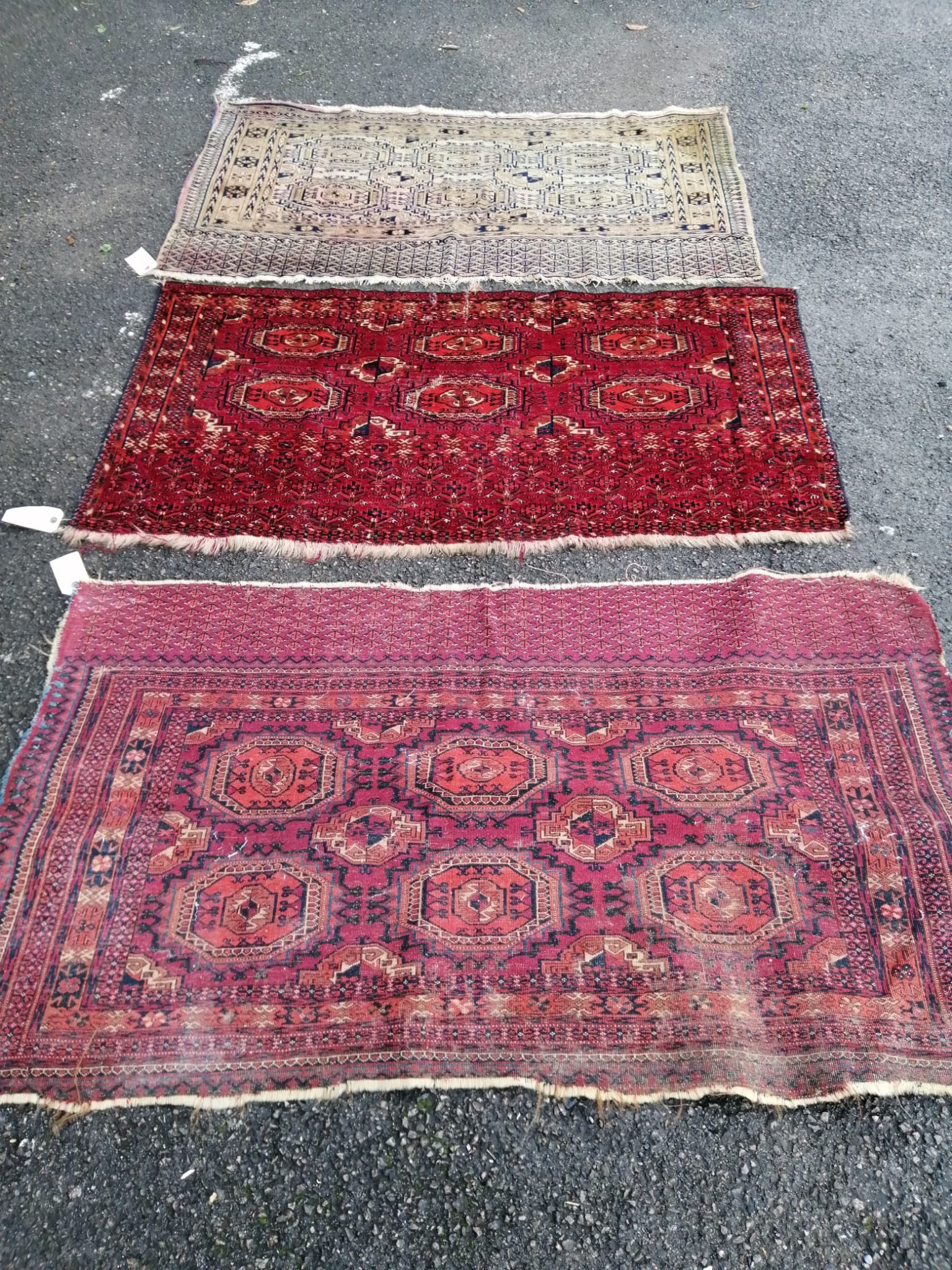 Three antique Salor mats, largest 140 x 82cm                                                                                                                                                                                