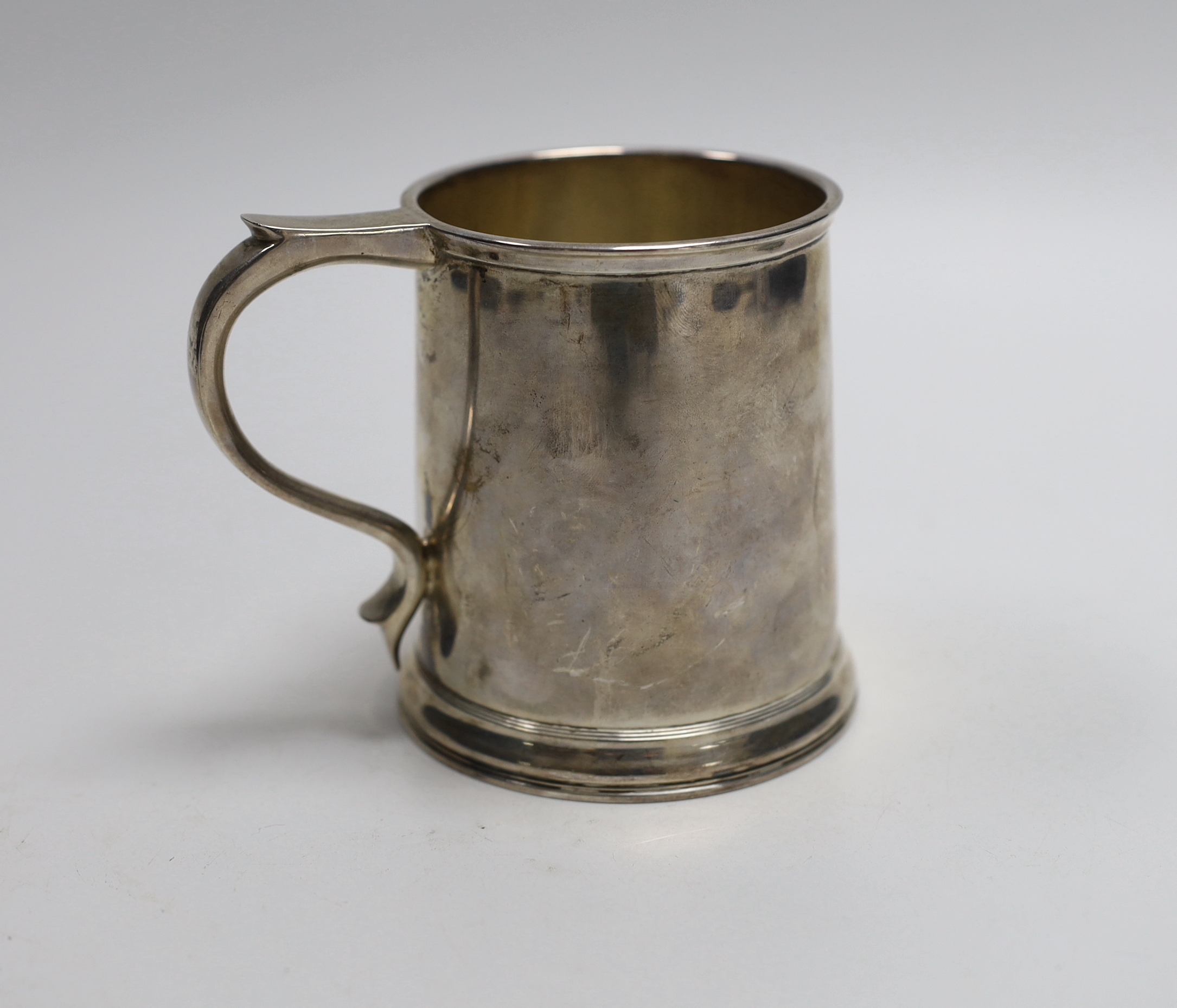 A George V silver mug, by Goldsmiths & Silversmiths Co Ltd, London, 1935, height 10cm, 13.5oz.                                                                                                                              