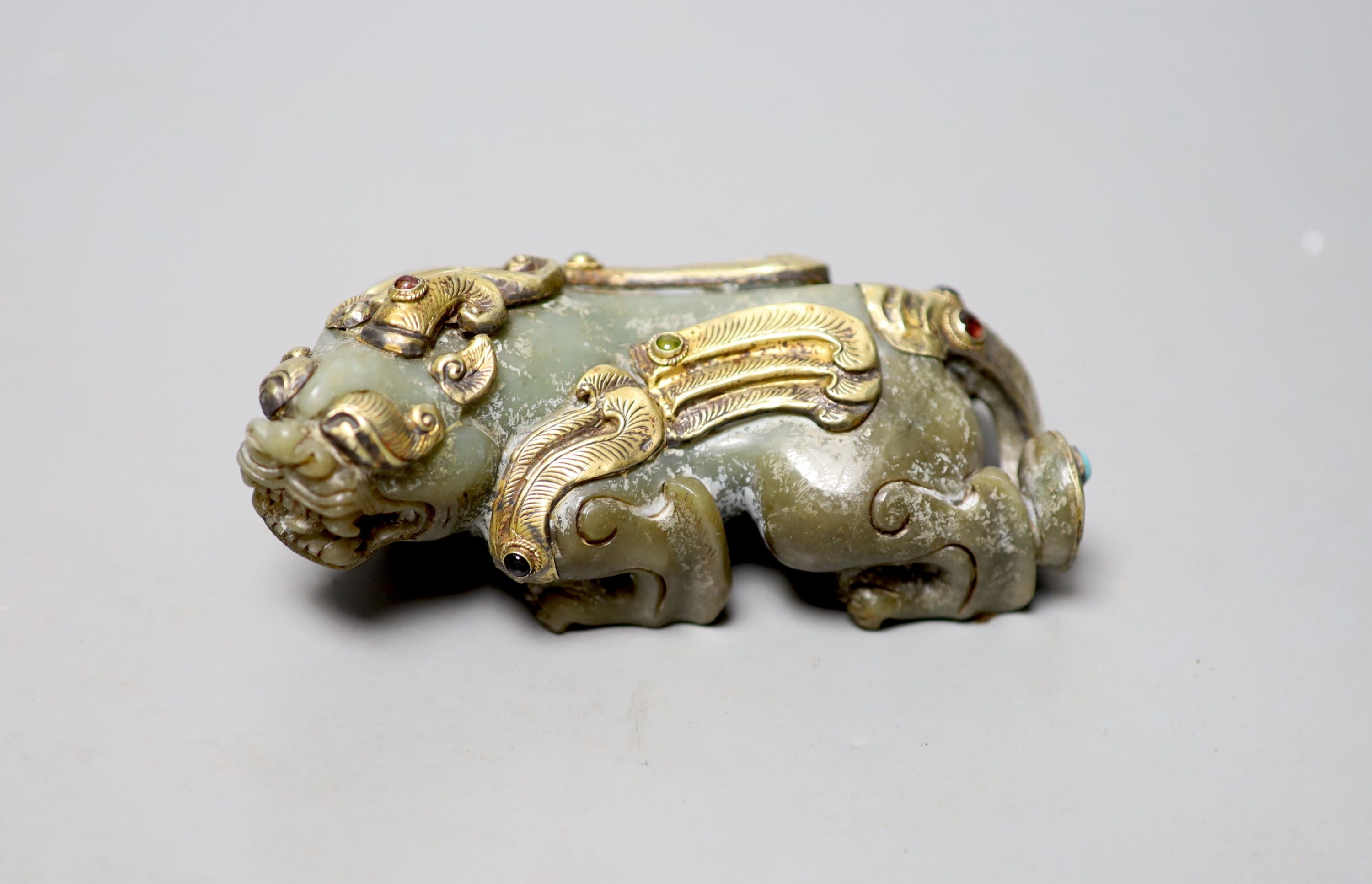 A Chinese celadon jade and gilt metal mounted figure of a Pixiu, 12cm long                                                                                                                                                  