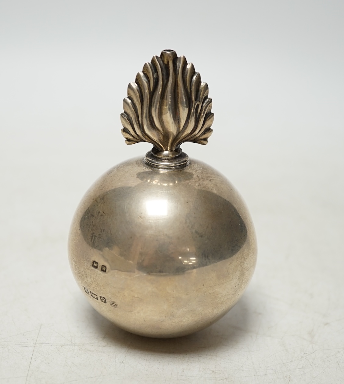 A George V silver 'grenade' table lighter, by A & J Zimmerman, Birmingham, 1921, height 10.2cm. Condition - poor to fair                                                                                                    