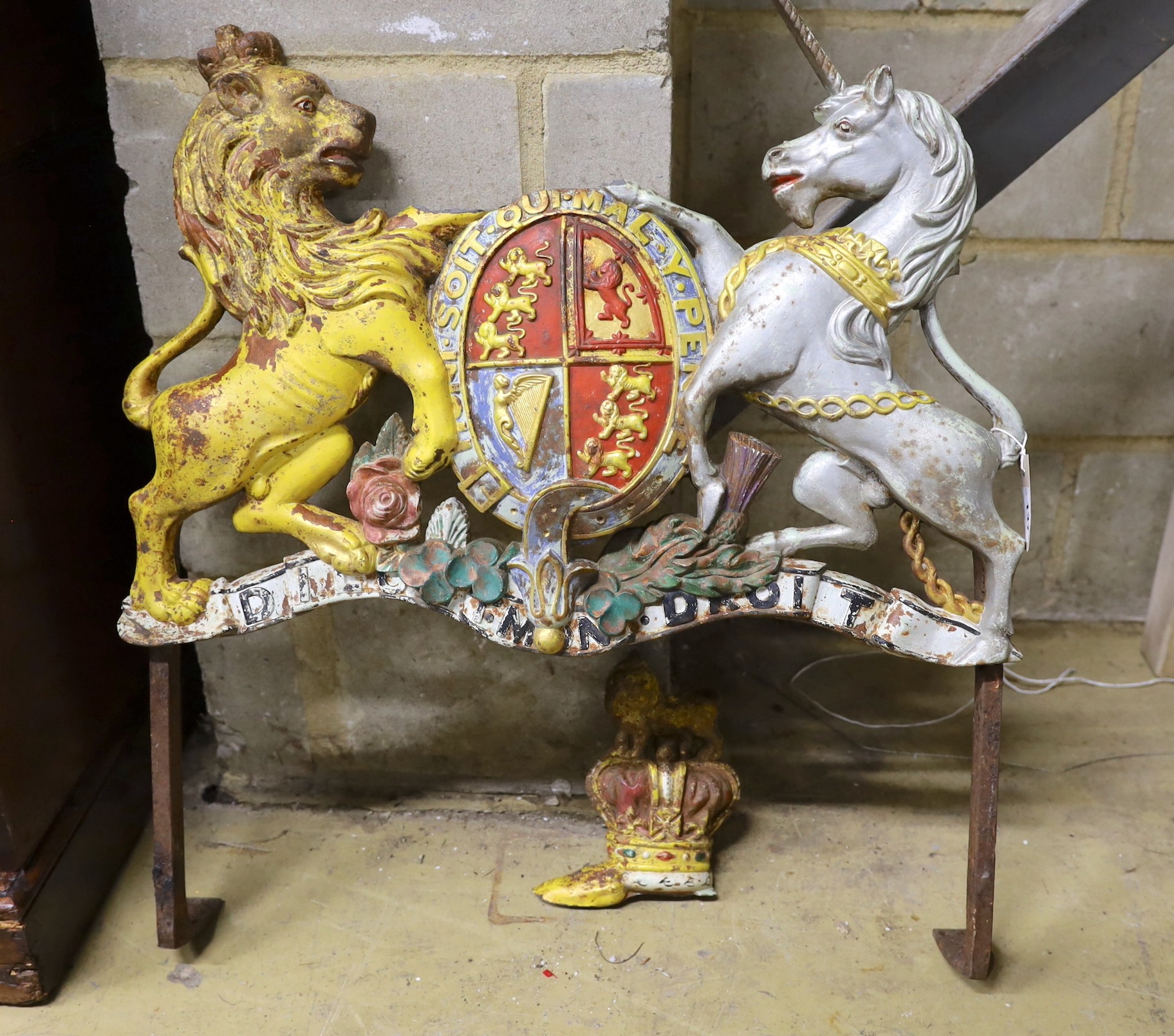 A painted cast iron Royal Coat of Arms, crown detached, width 70cm, height 78cm                                                                                                                                             