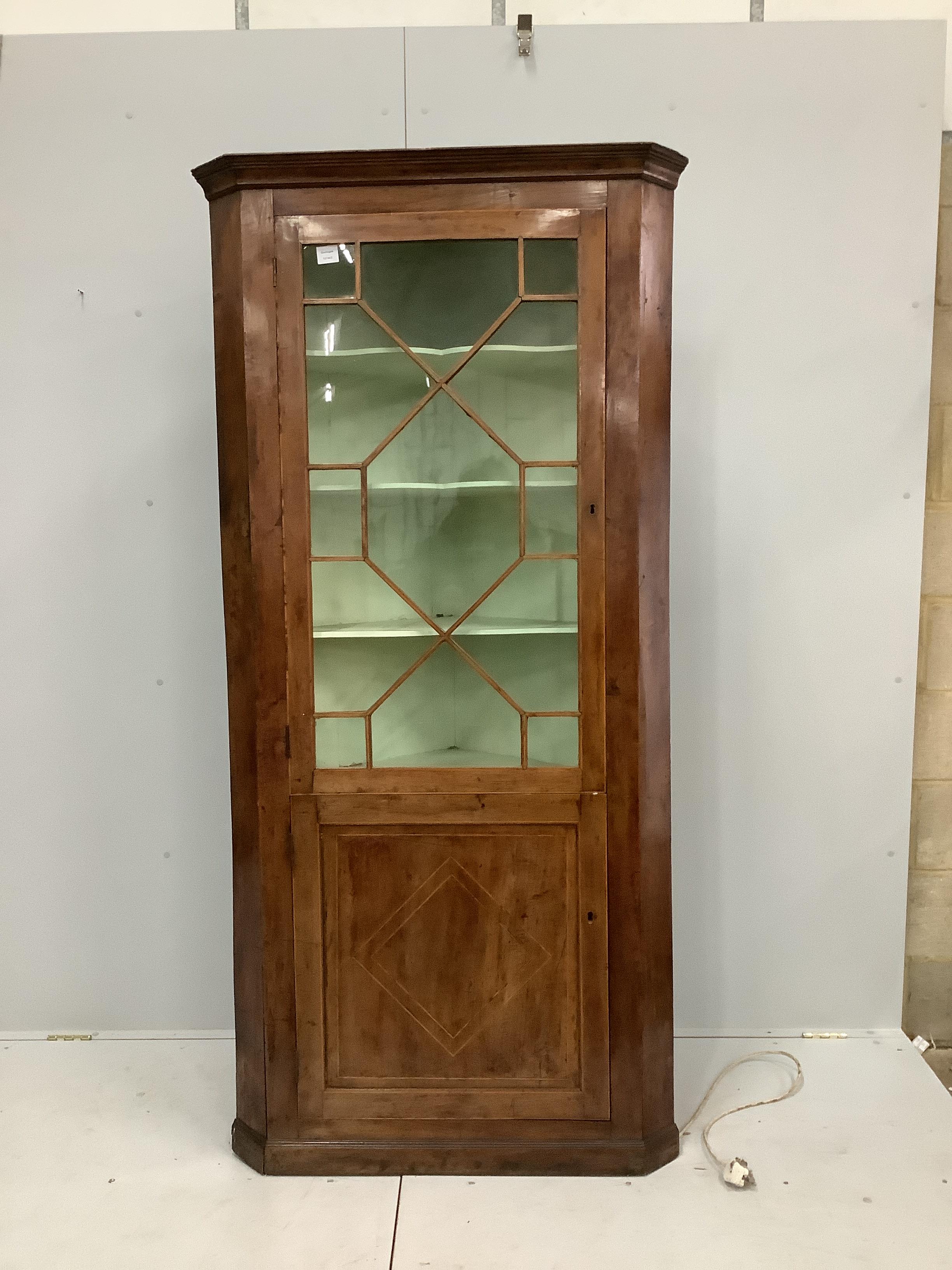 A George III mahogany standing corner cupboard, width 93cm, depth 50cm, height 198cm                                                                                                                                        