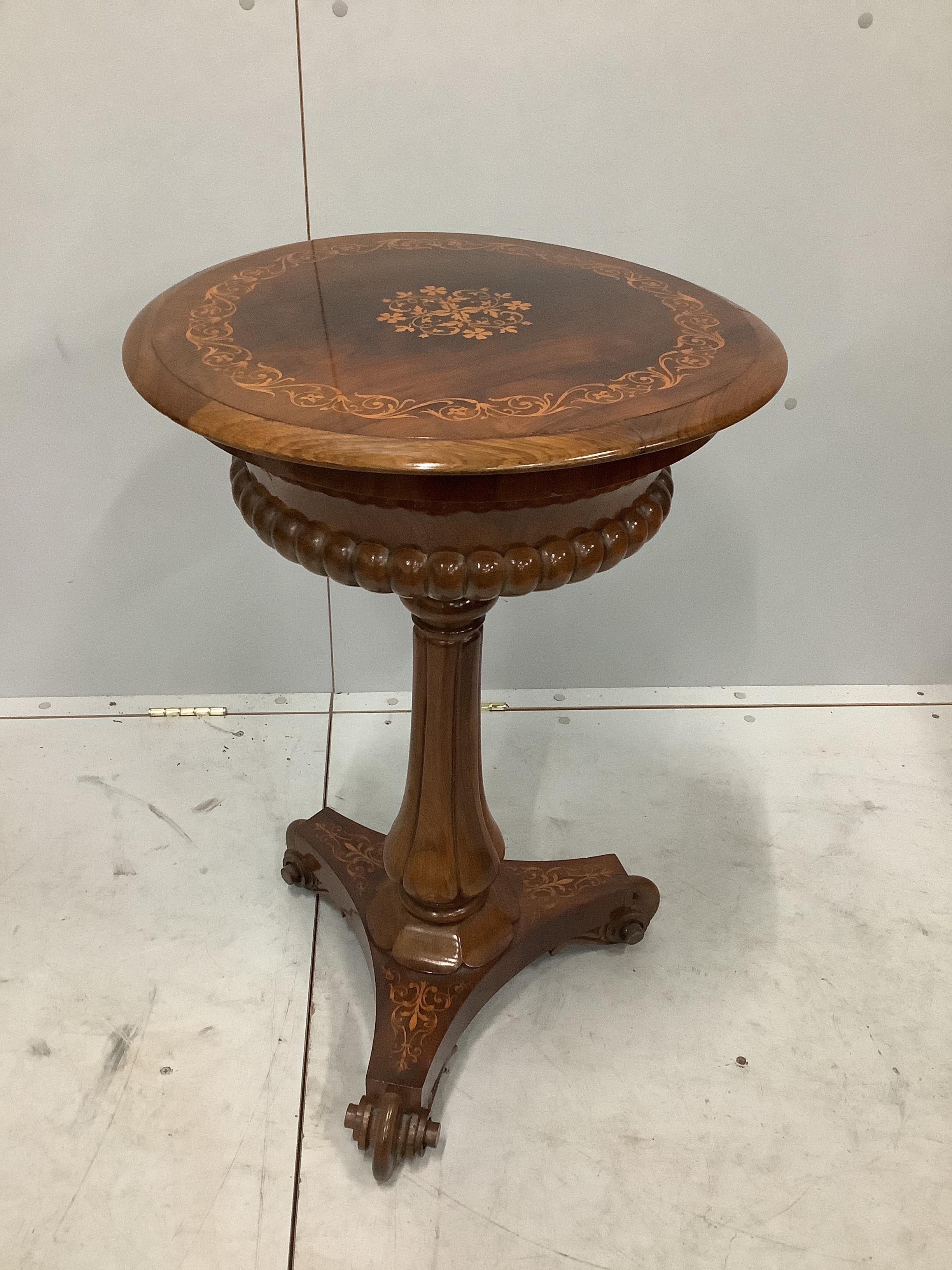A 19th century French inlaid rosewood circular topped work table, diameter 50cm, height 74cm                                                                                                                                