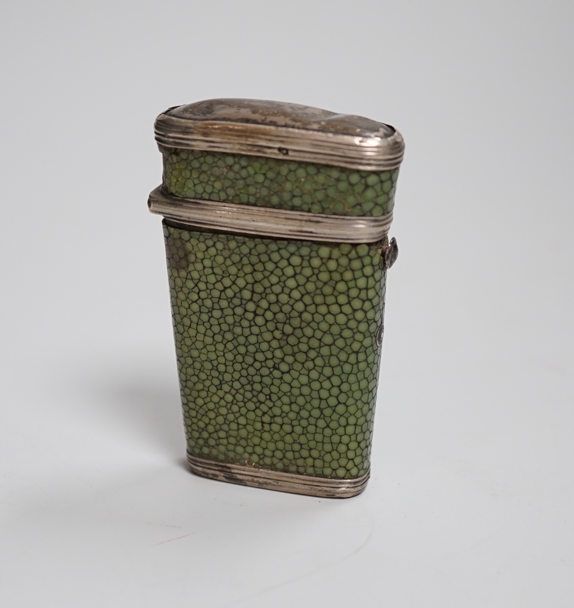 A George III silver mounted shagreen fleam etui, containing four tortoiseshell handled folding blades, with two vacant compartments, 7.5cm                                                                                  