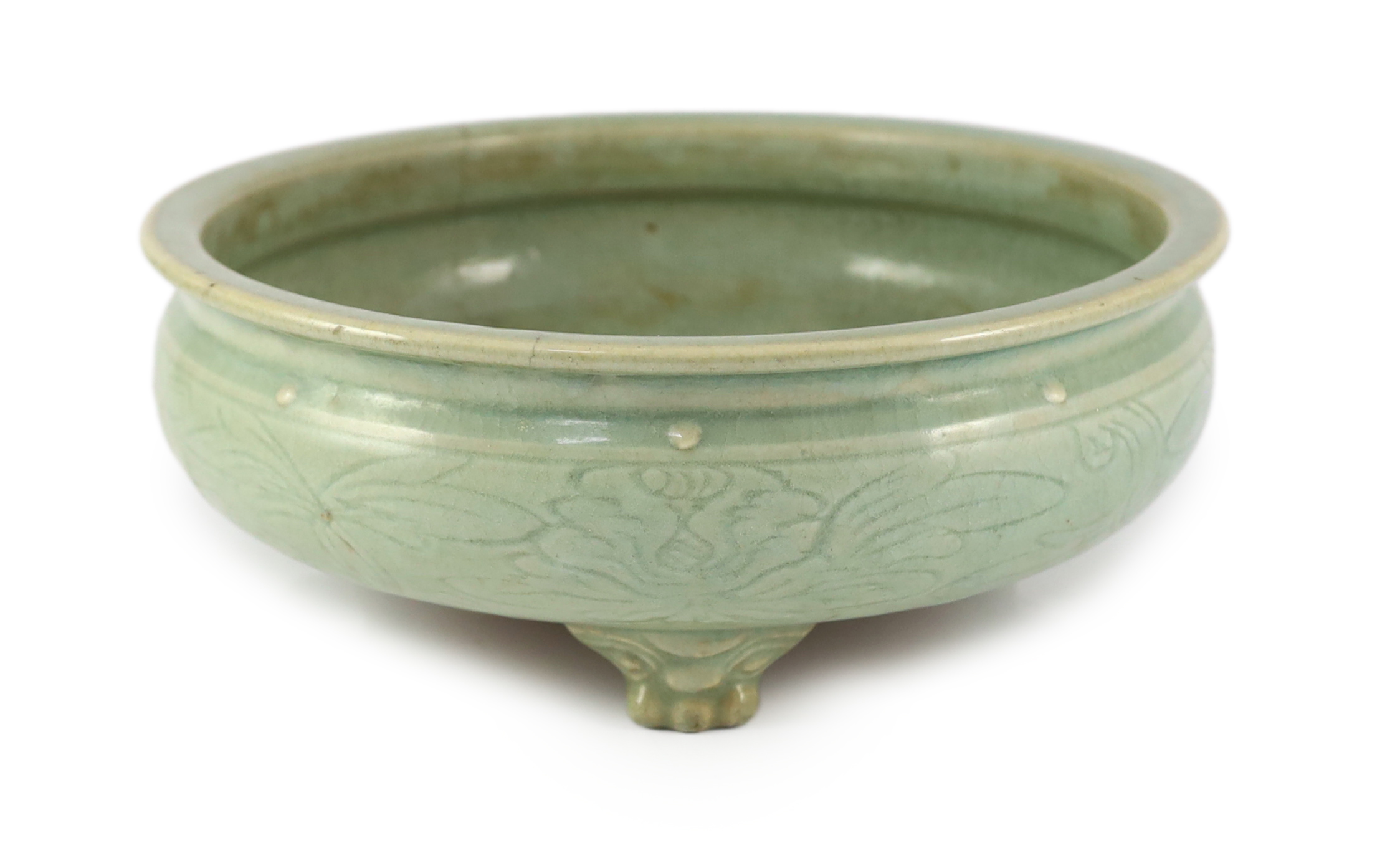 A large Chinese Longquan celadon ‘magnolia’ tripod censer, Ming dynasty                                                                                                                                                     