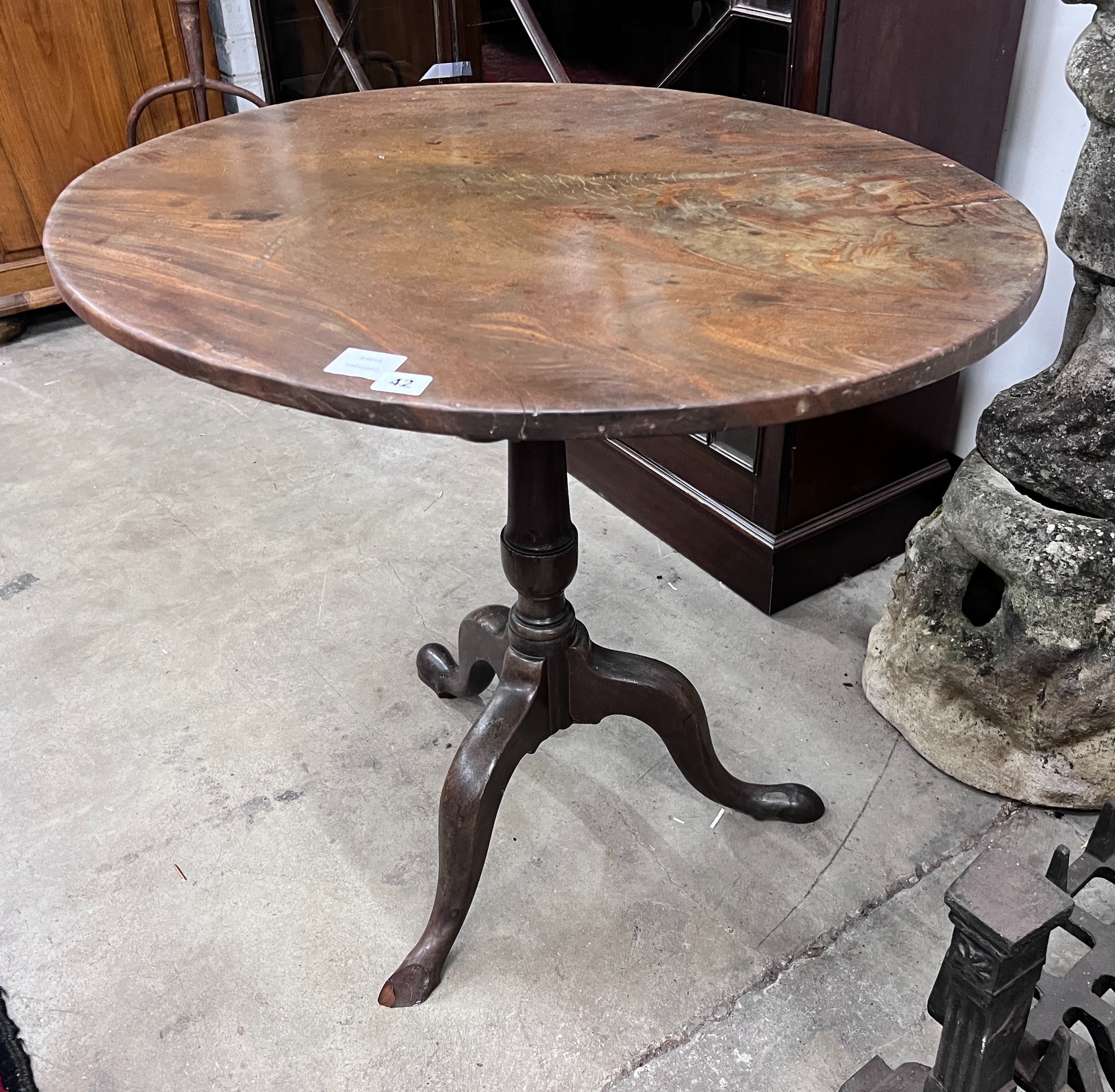 A George III oval top tilt top tripod tea table, width 79cm, depth 65cm, height 71cm *Please note the sale commences at 9am.                                                                                                