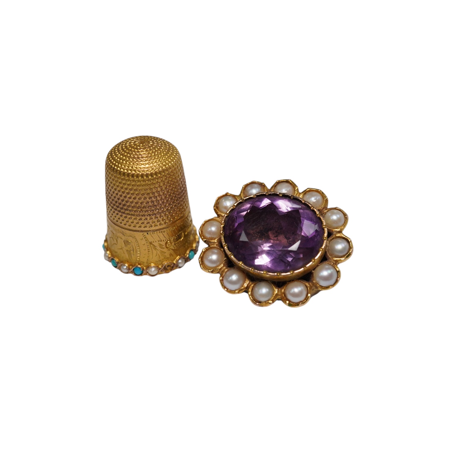 A George V 9ct gold, turquoise and seed pearl set thimble, 5.9 grams, and an amethyst and split pearl set yellow metal clasp, converted to a brooch. Condition - poor to fair                                               