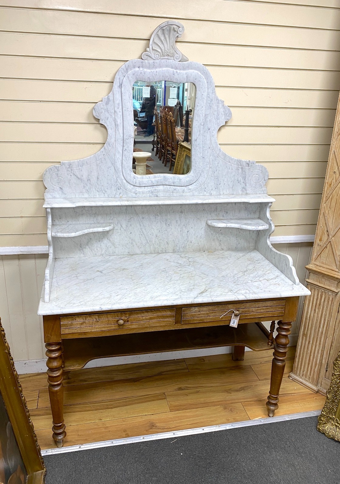 A 19th century French mahogany marble top washstand with high mirrored back, width 130cm, depth 60cm, height 204cm                                                                                                          