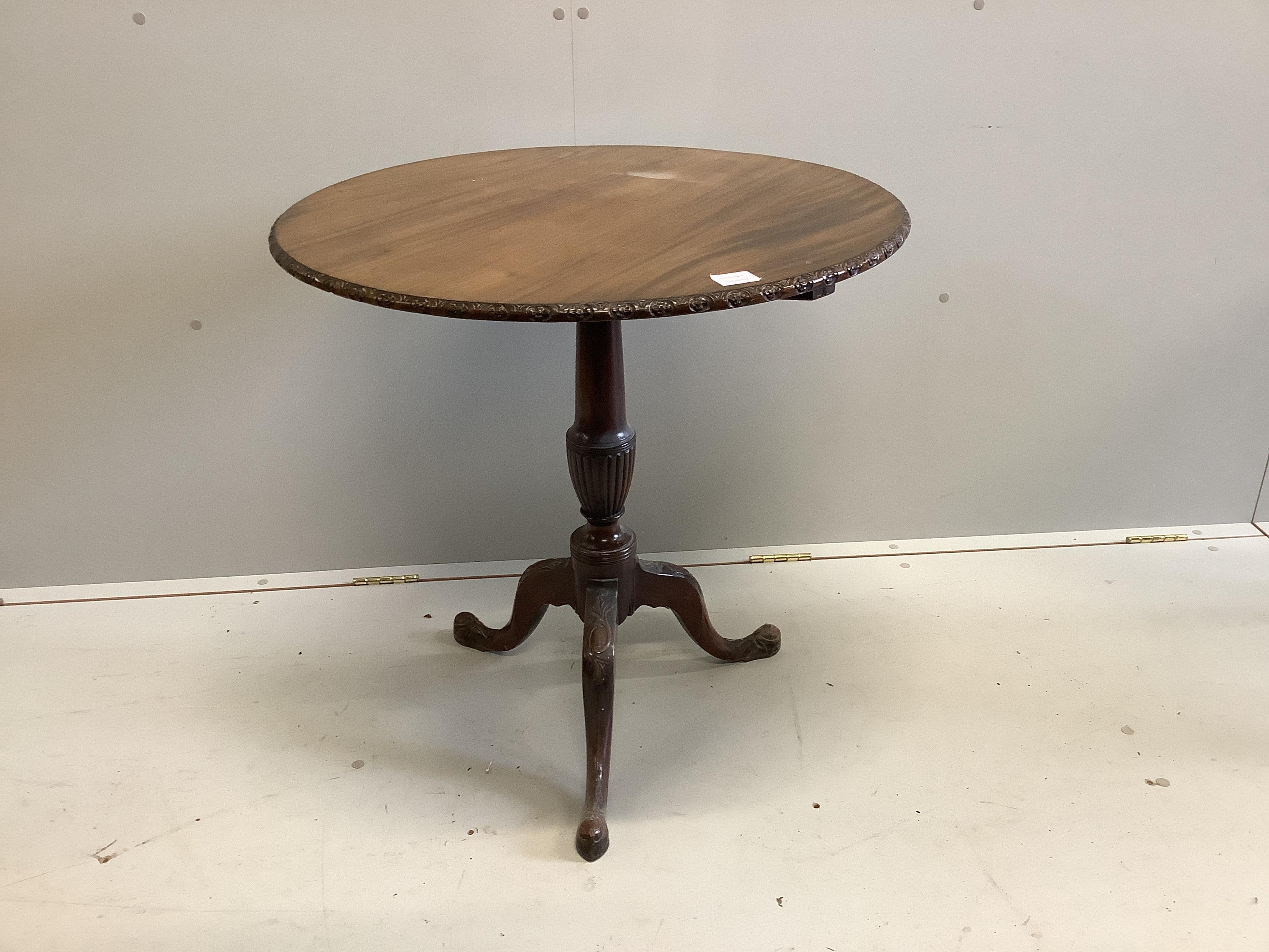 A George III style circular mahogany tilt top tripod tea table, diameter 76cm, height 72cm                                                                                                                                  