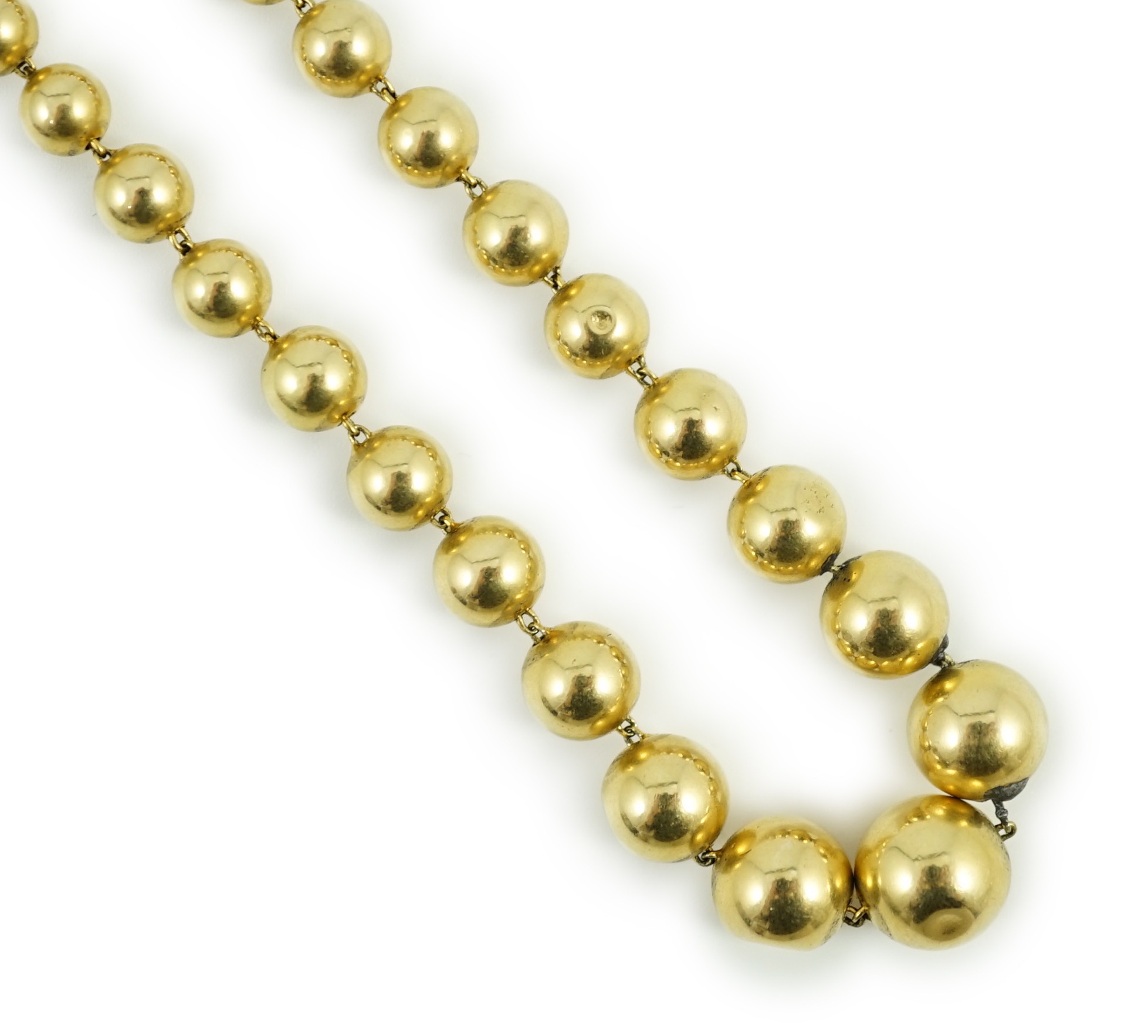 A French? graduated yellow metal bead necklace, 42cm, gross 21.4 grams.                                                                                                                                                     