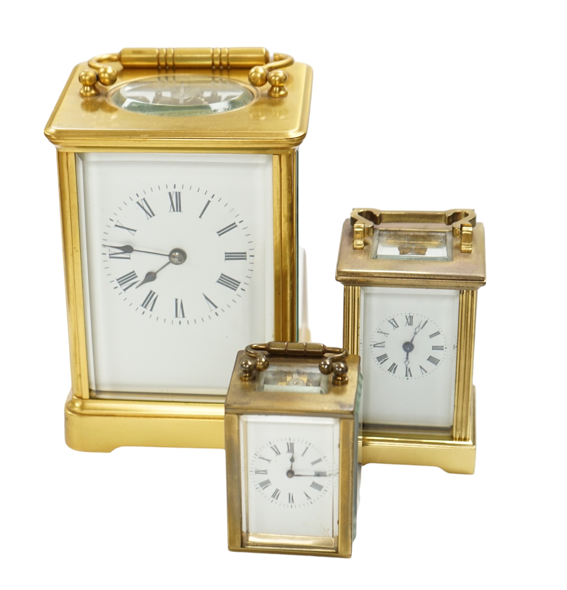 A French carriage clock and two other miniature carriage clocks, largest 13cm high. Condition - fair to good, not tested as working                                                                                         