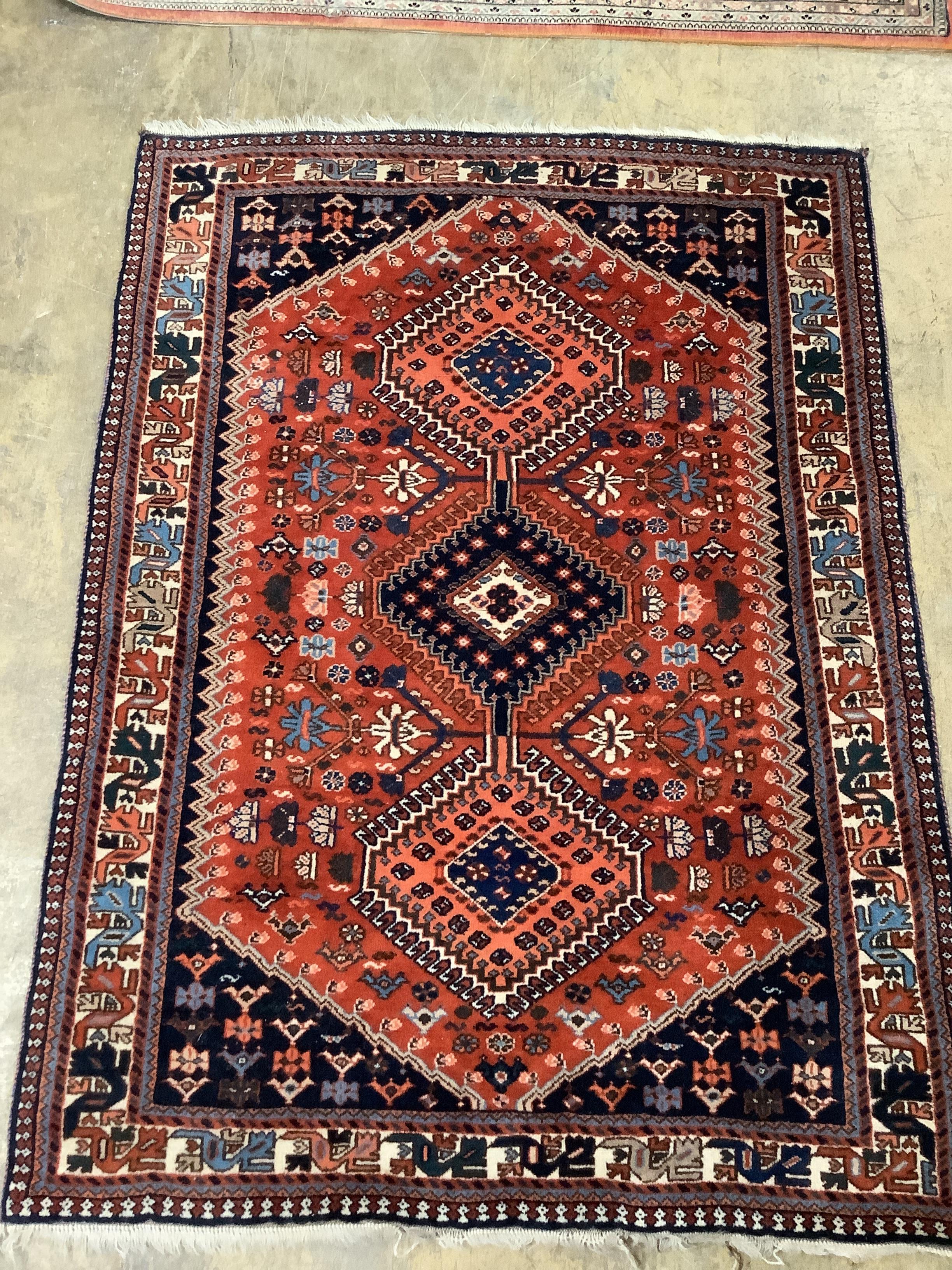 A Caucasian red ground rug, 144 x 105cm                                                                                                                                                                                     
