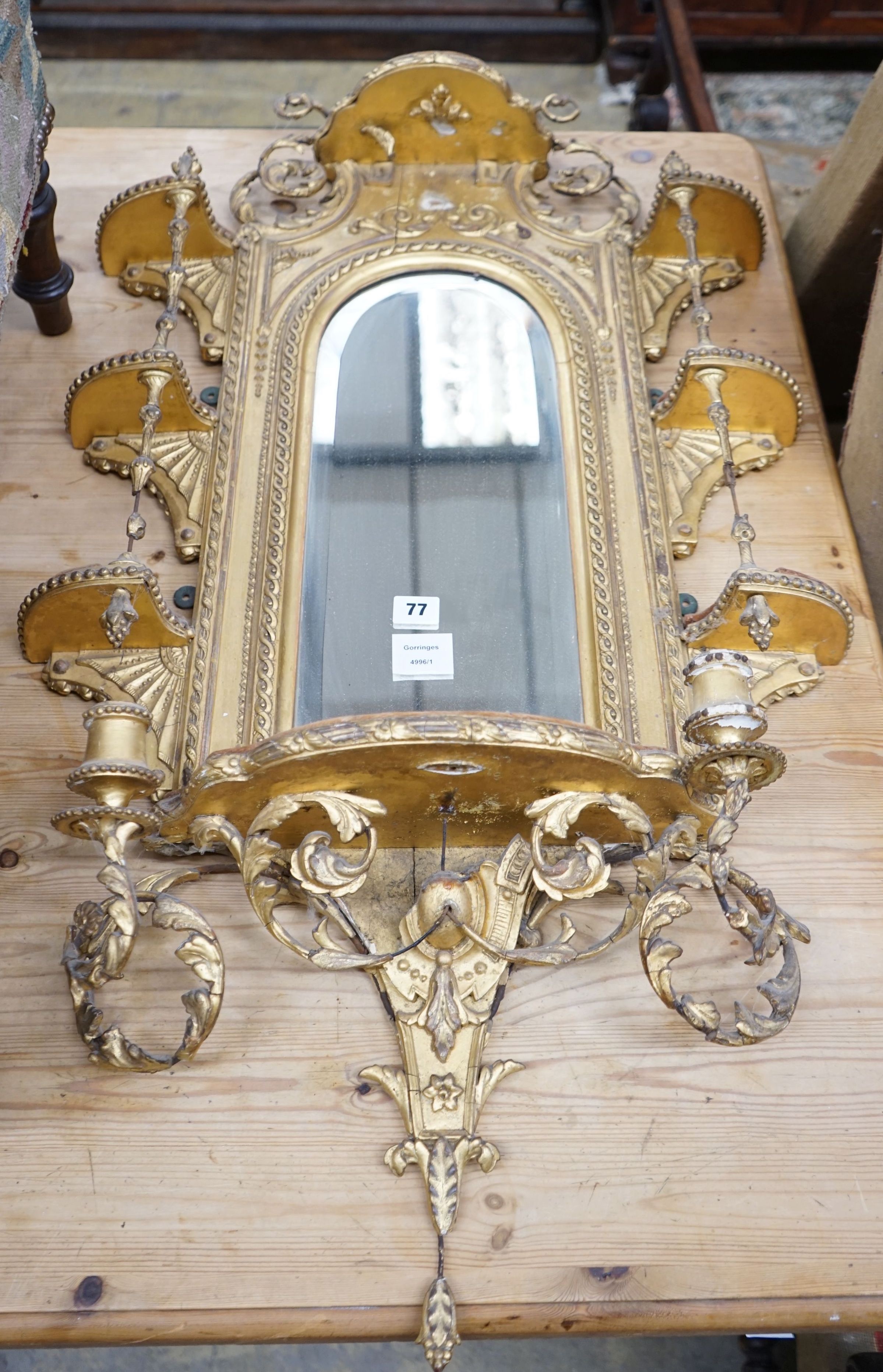 A Victorian giltwood and gesso girandole, width 56cm, height 84cm                                                                                                                                                           